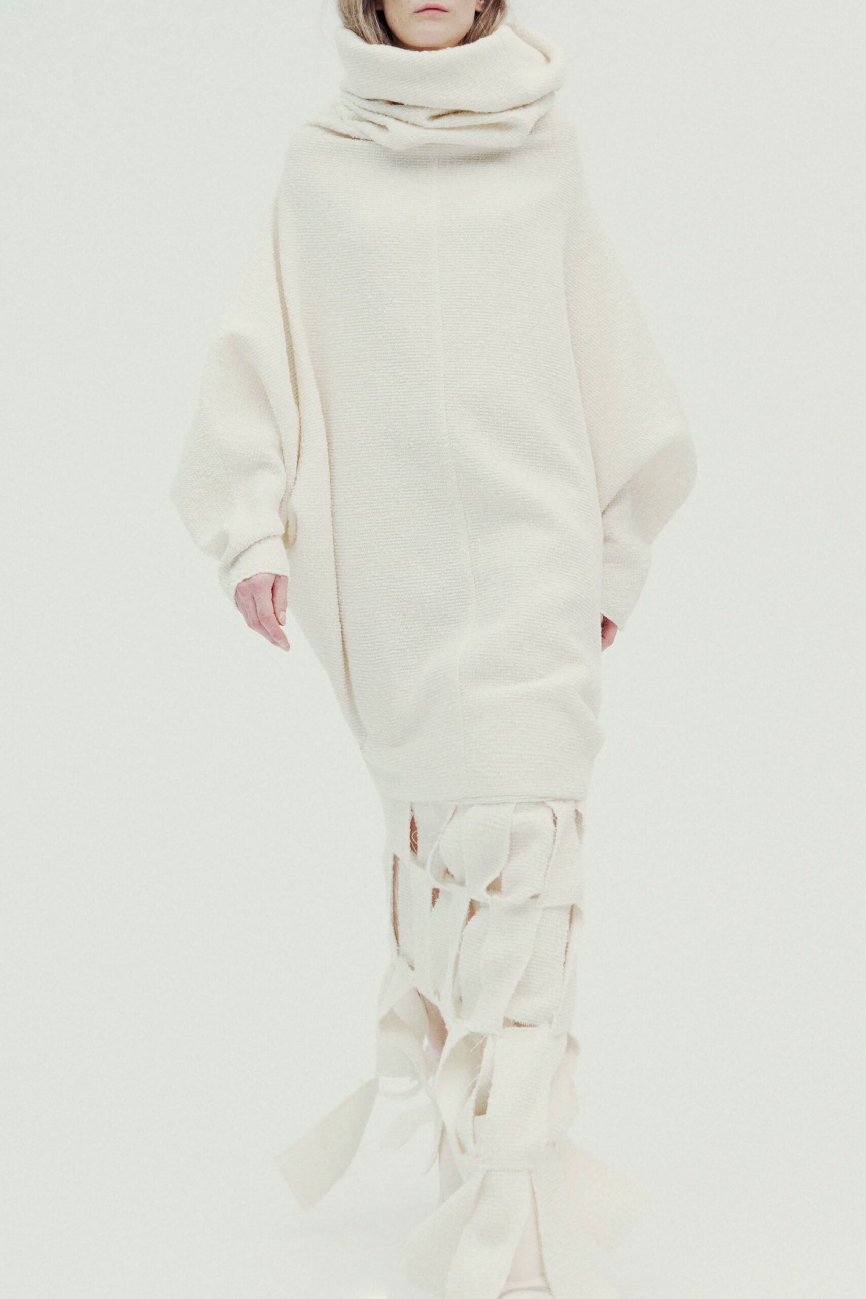 white oversized dress with fringed pants