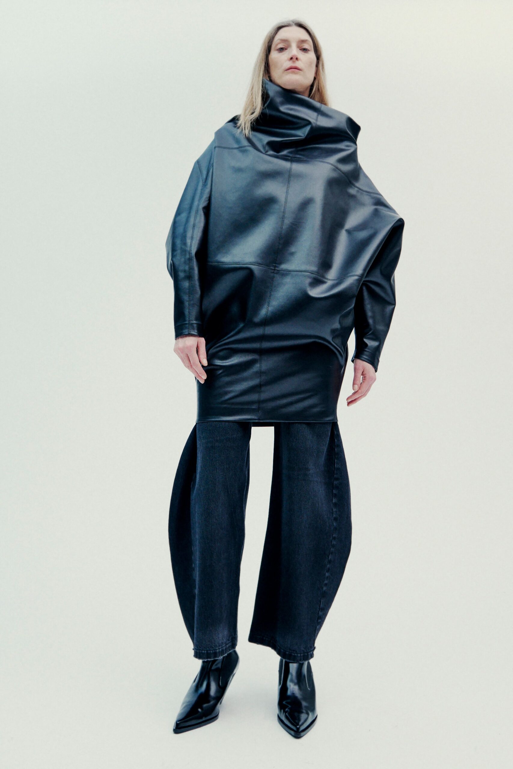 black leather oversized top with relaxed pants