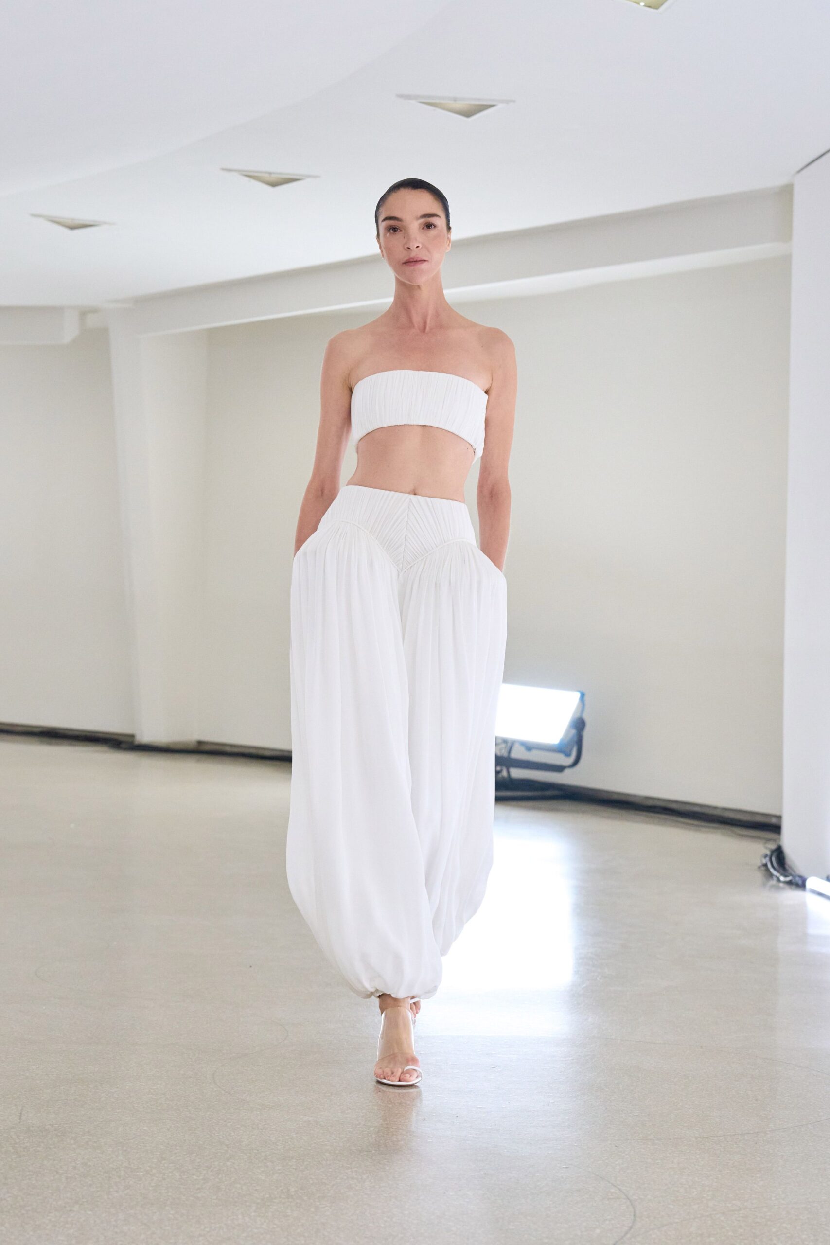 white silk sleeveless strapless fitted pleated top