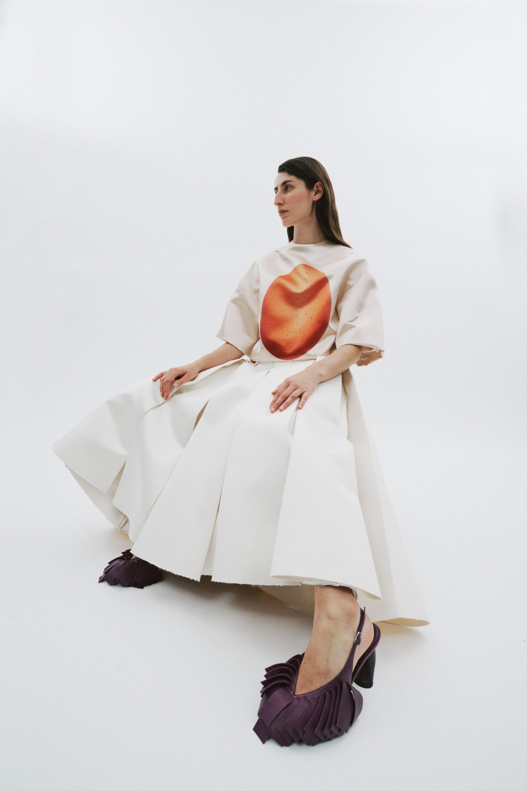 white pleated midi dress with orange detail
