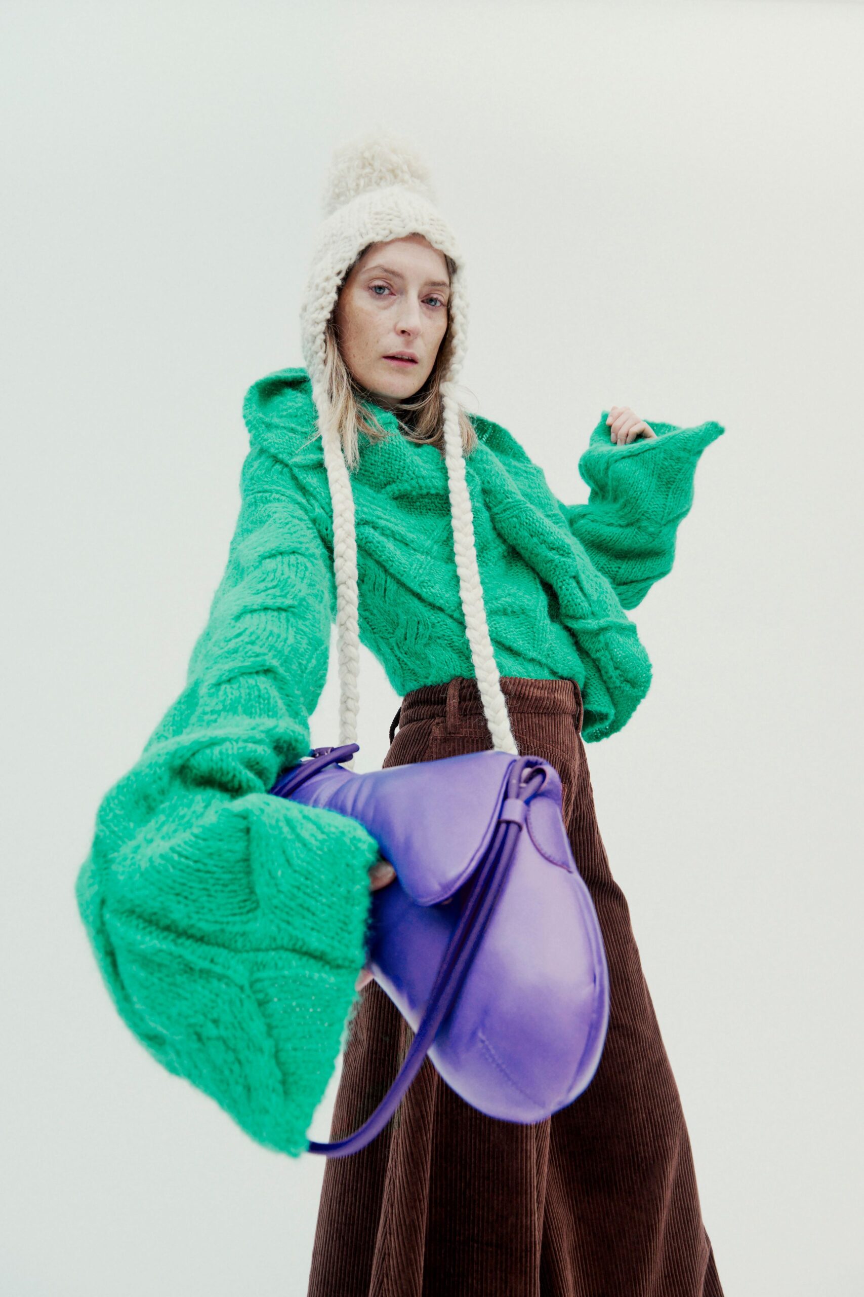 green knit long-sleeve hooded relaxed textured top