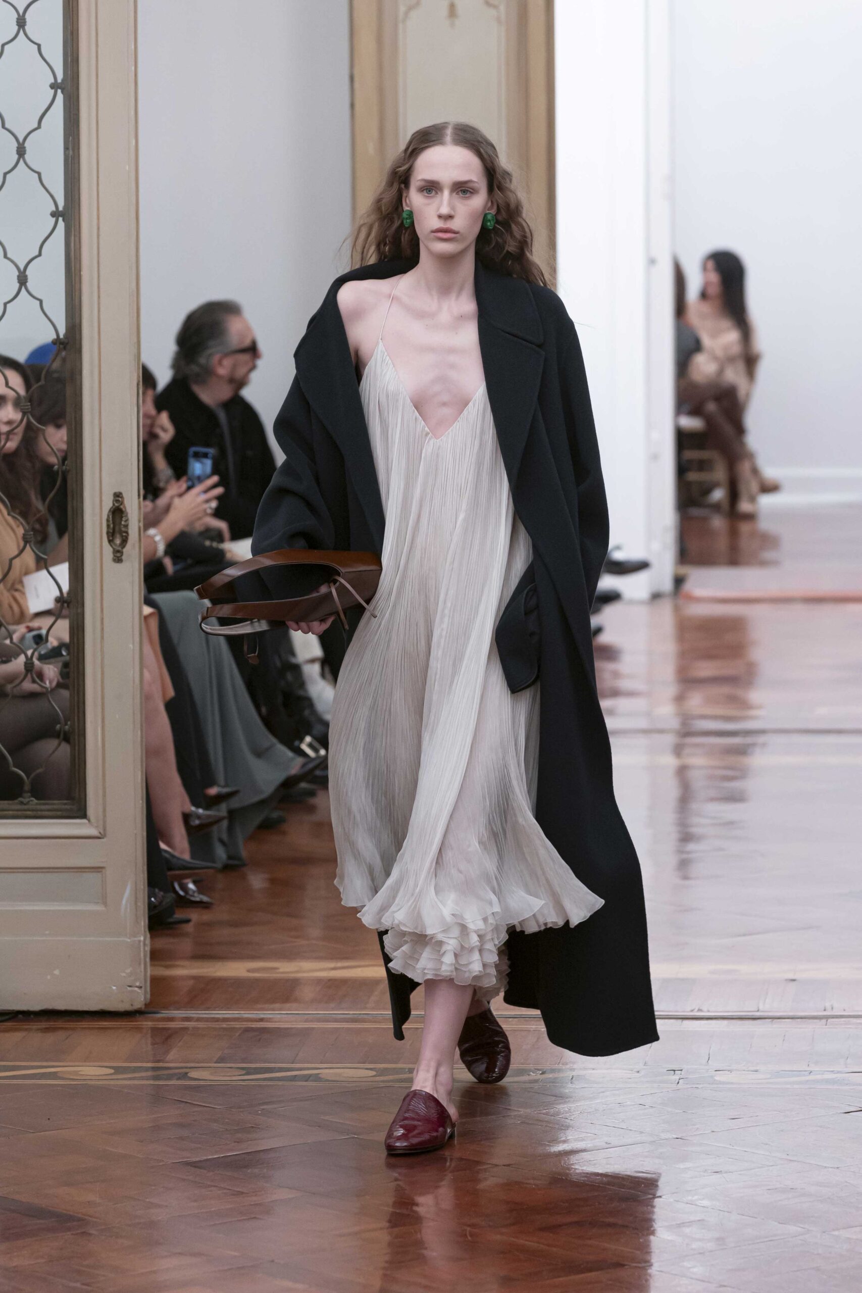 white silk pleated midi dress with black coat