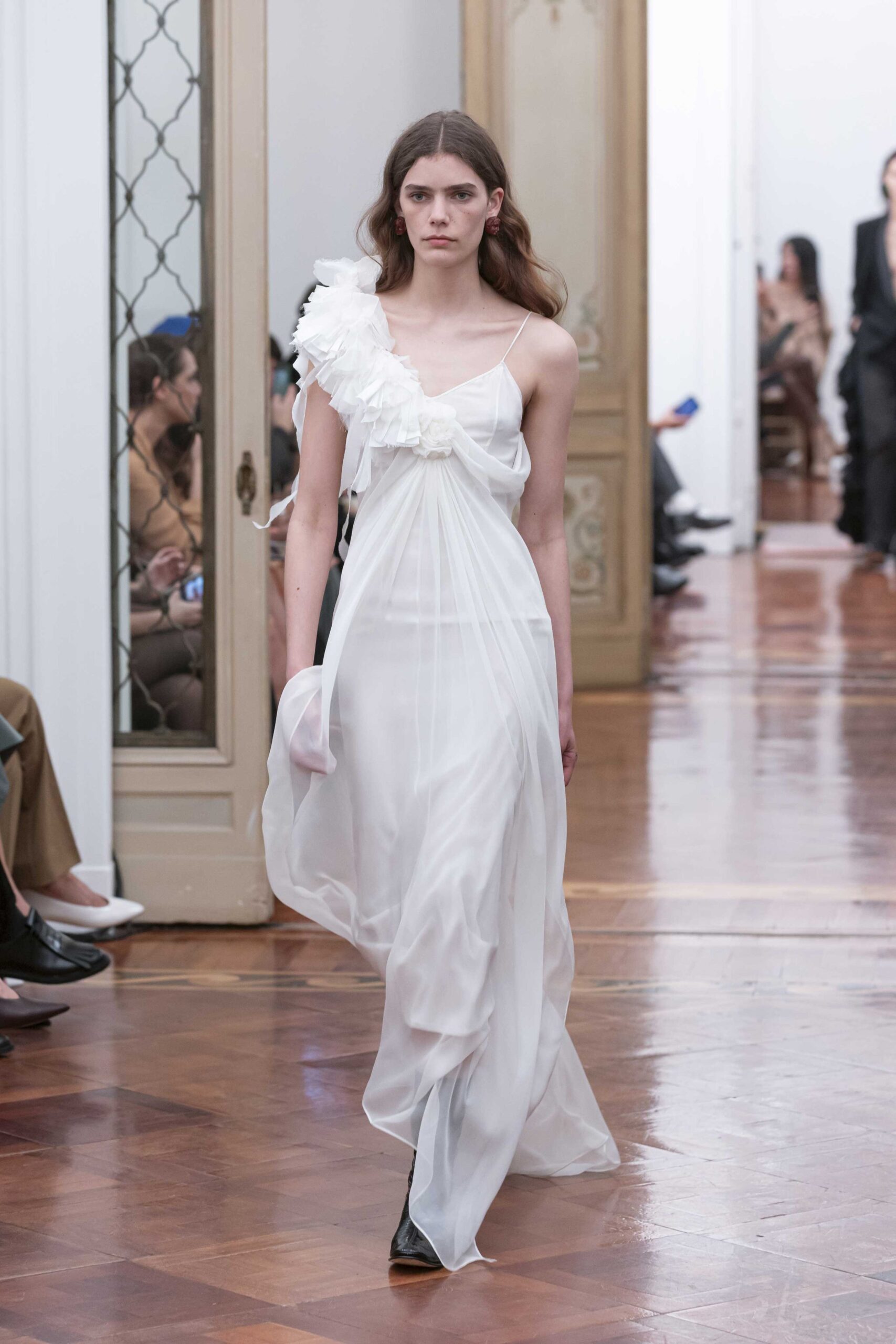 white flowing maxi dress with black shoes