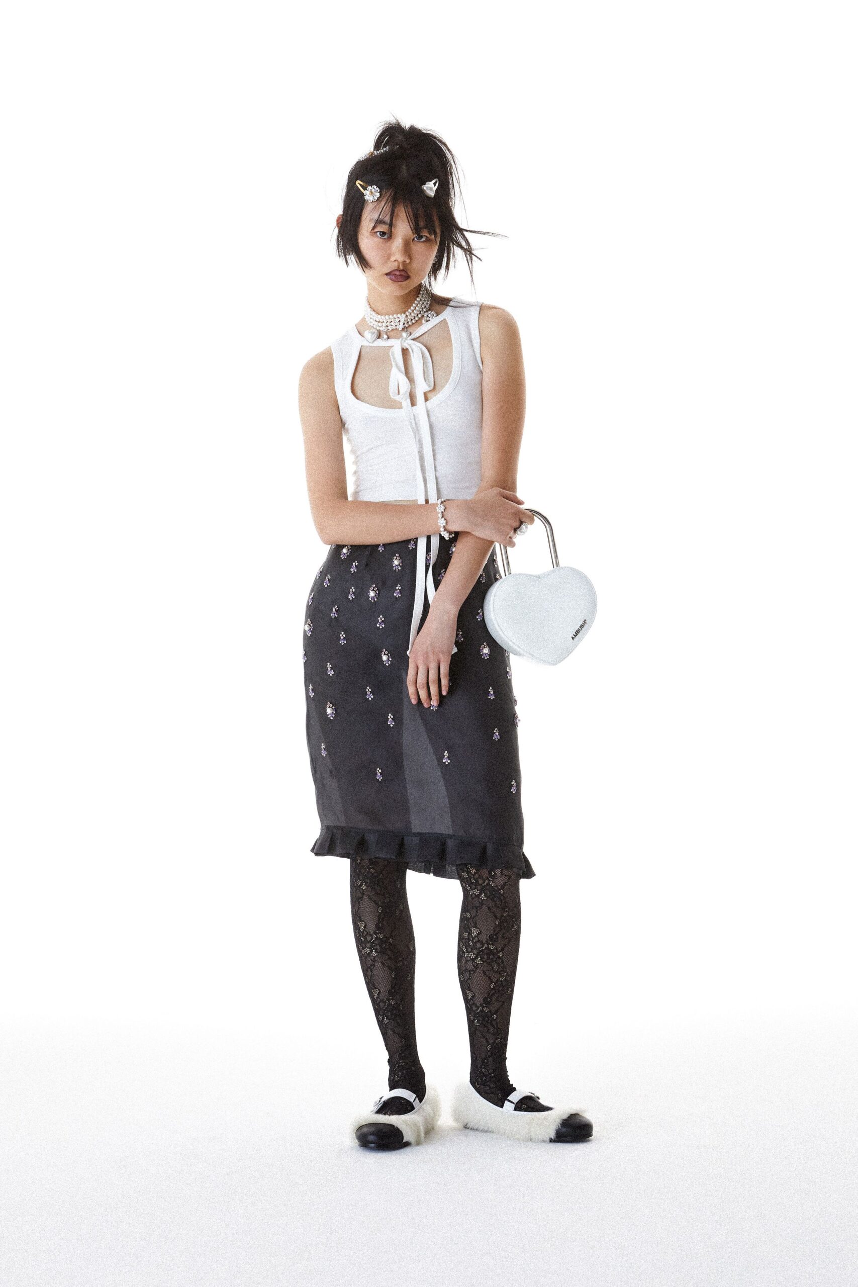 white fitted top with black skirt