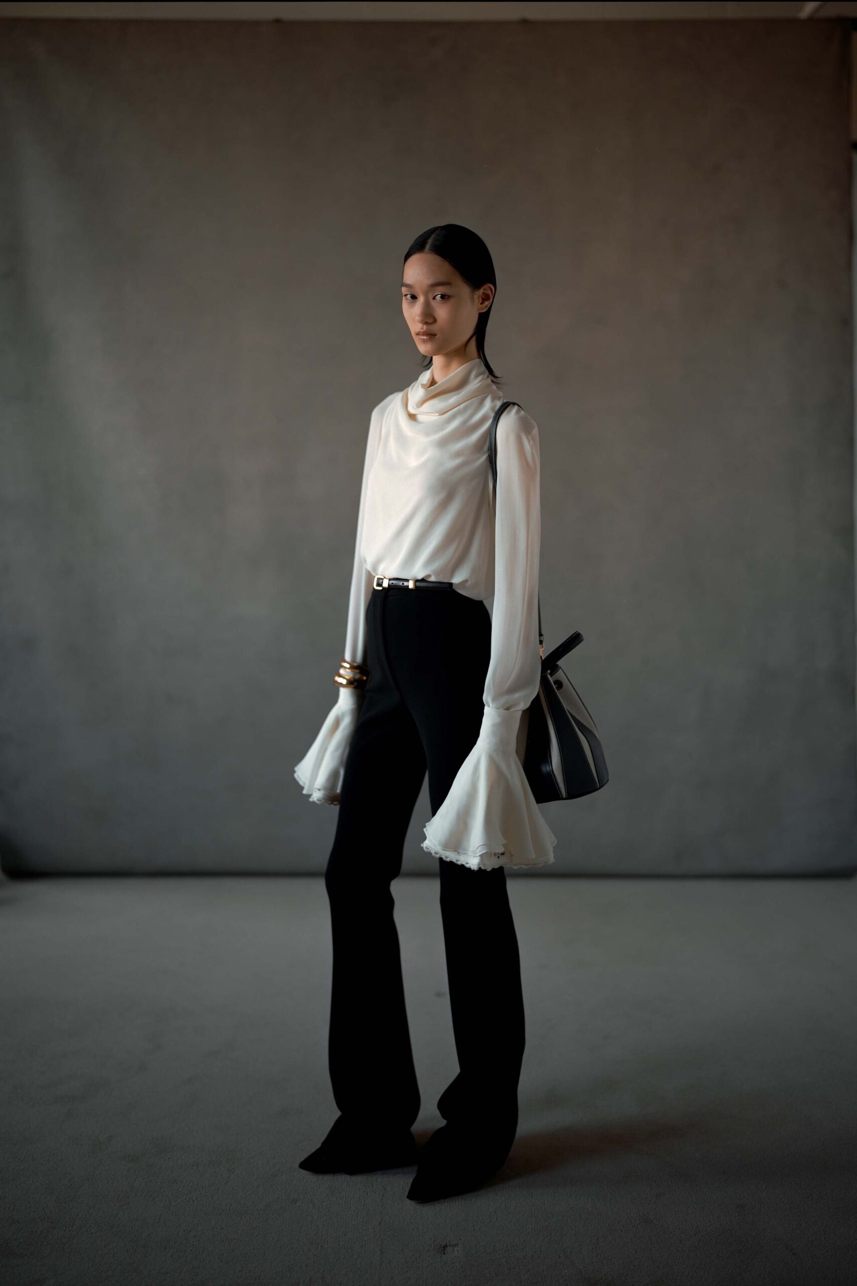 white silk fitted top with black pants