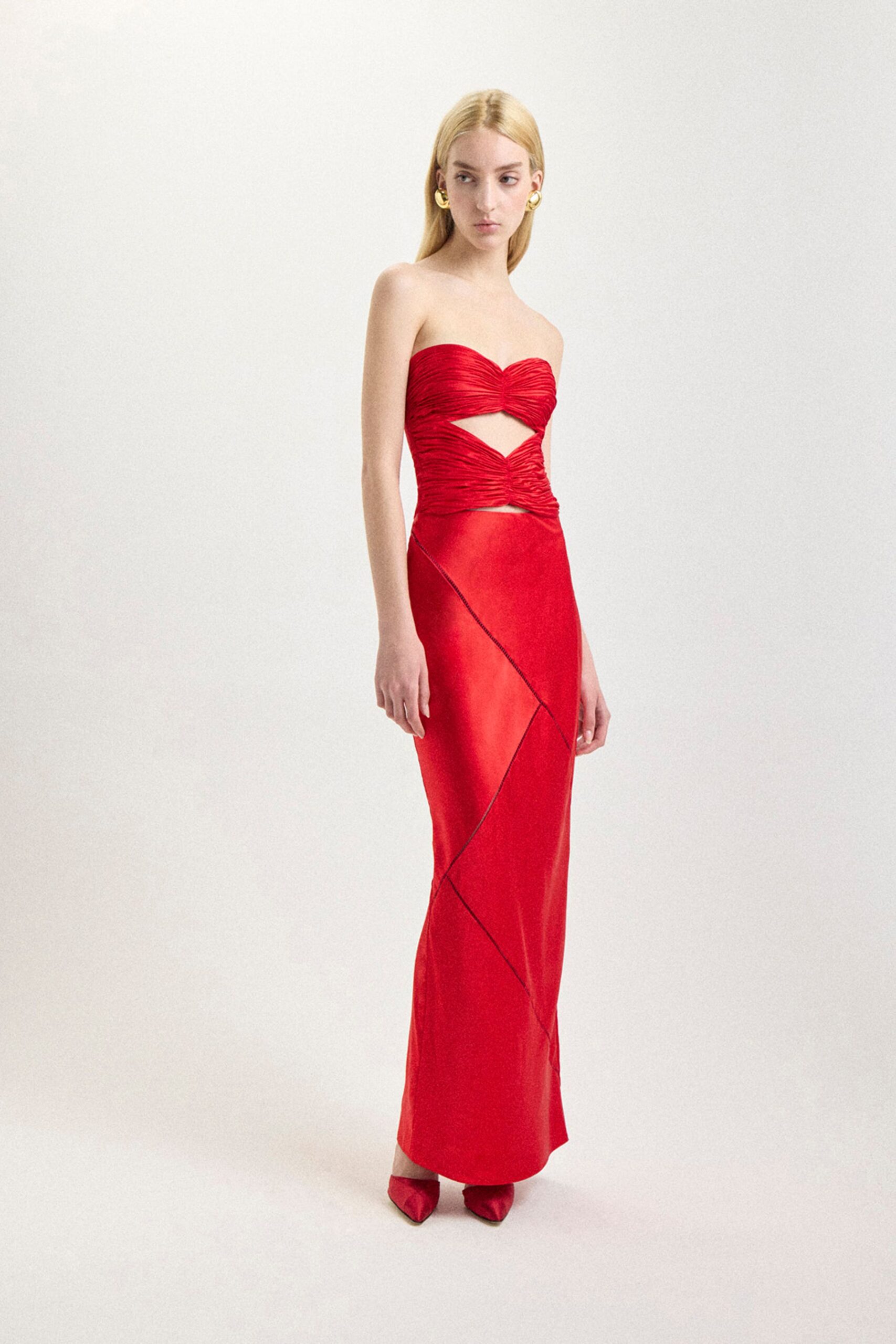 red silk strapless cutout fitted ruched draped gown