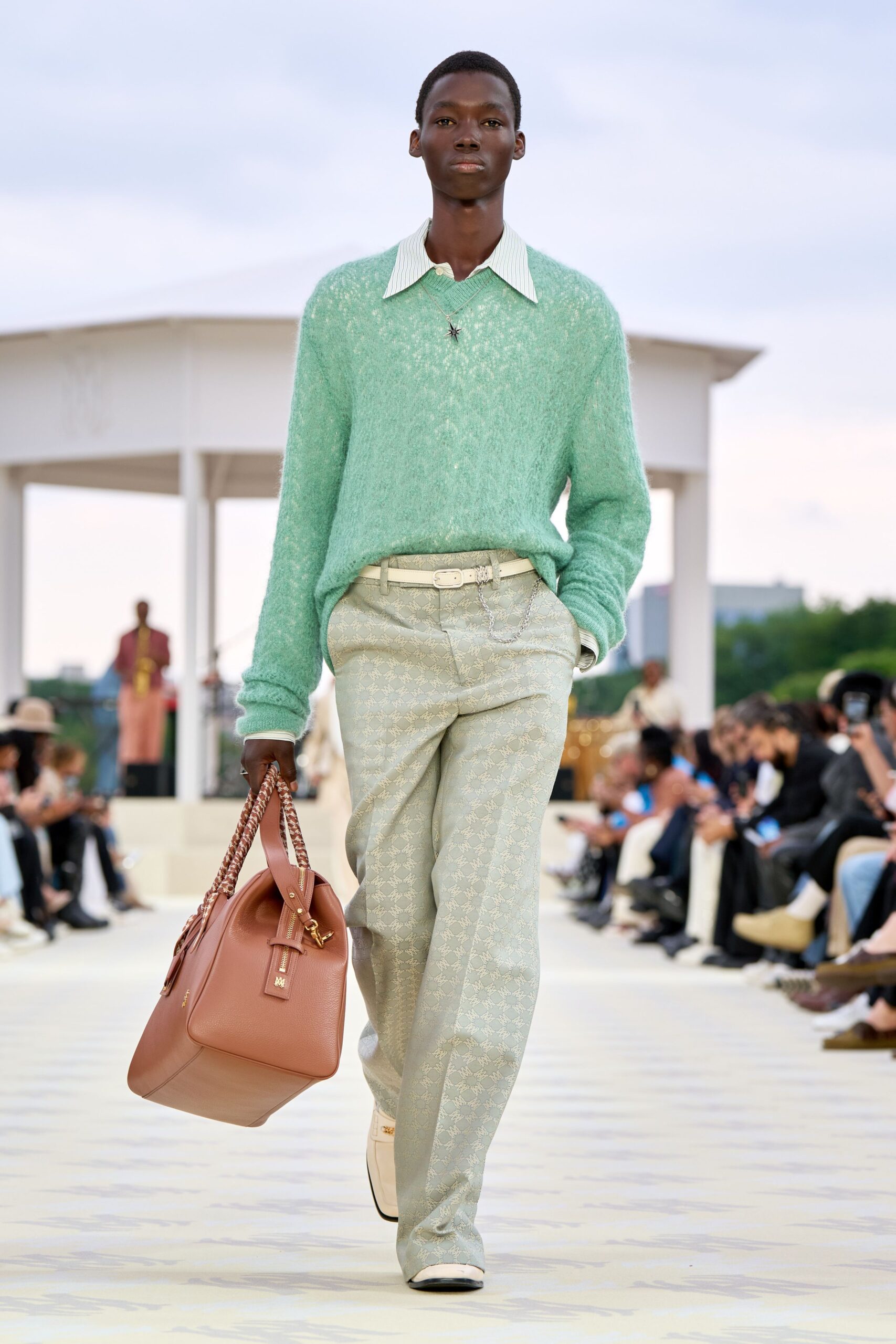green wool sweater with beige pants