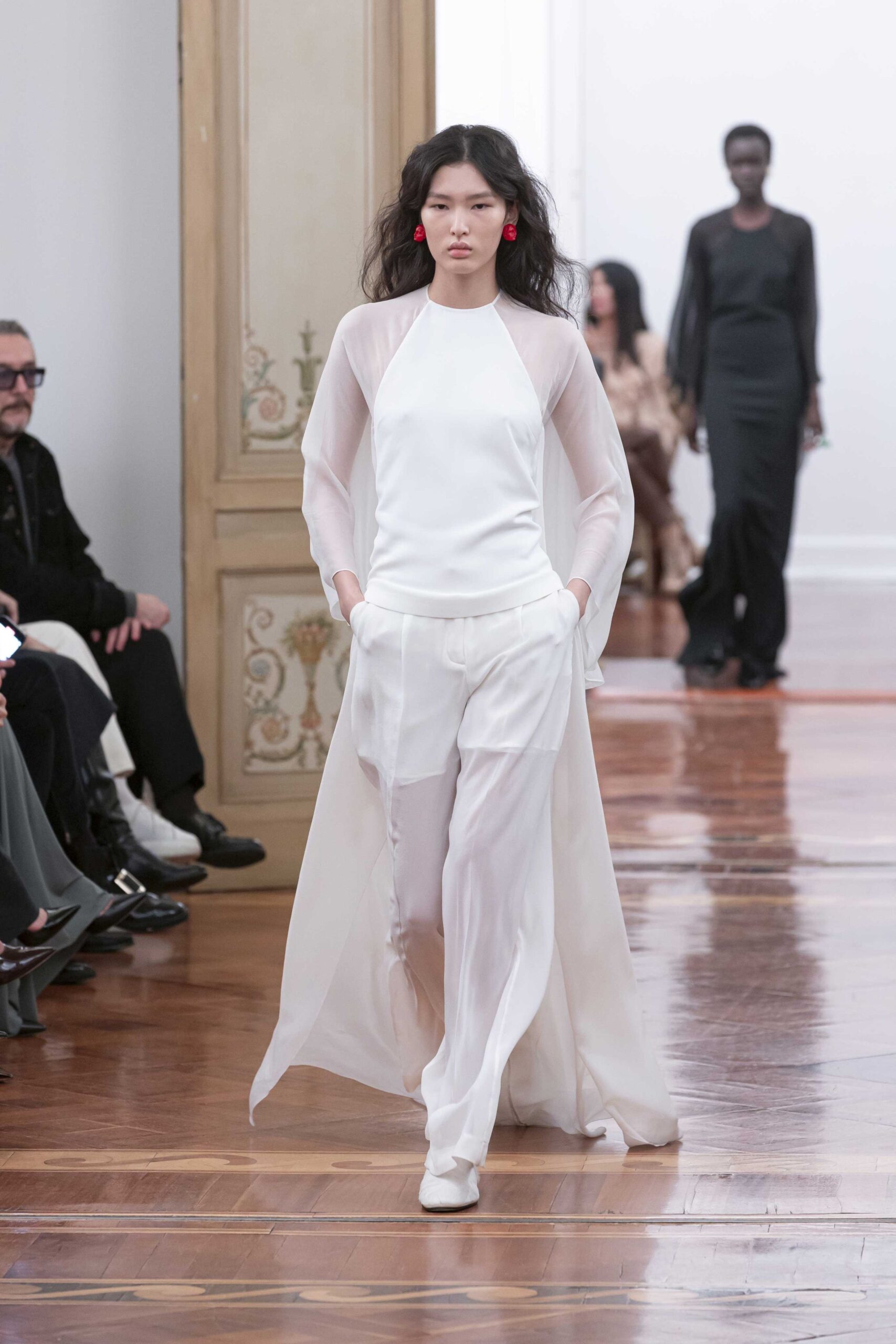 white silk sleeveless top with relaxed pants