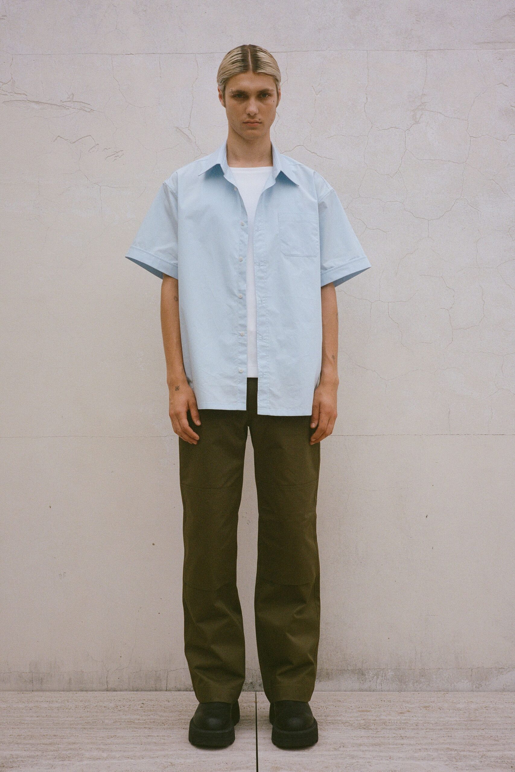 light blue shirt with olive pants