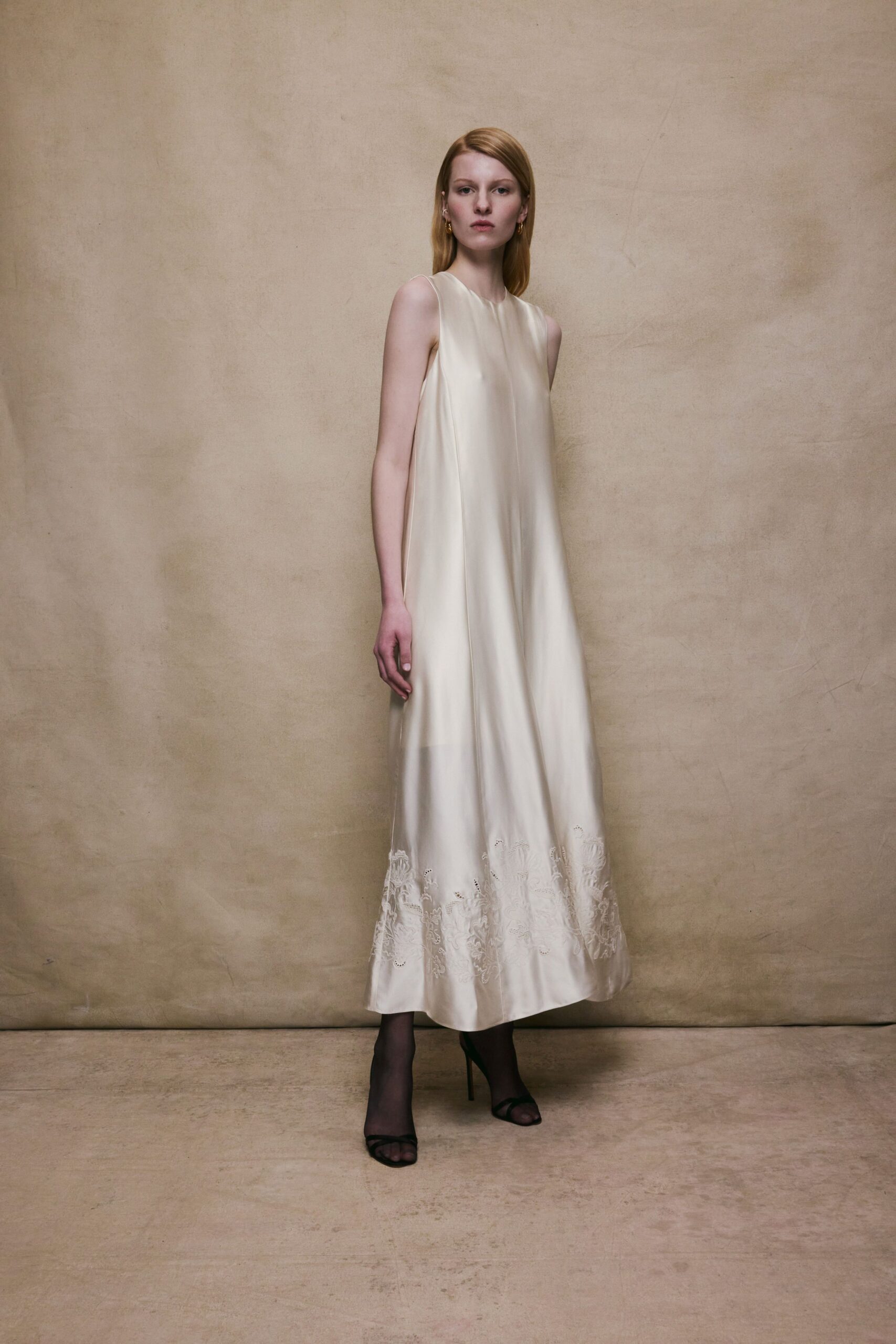 ivory silk embroidered gown with black heels