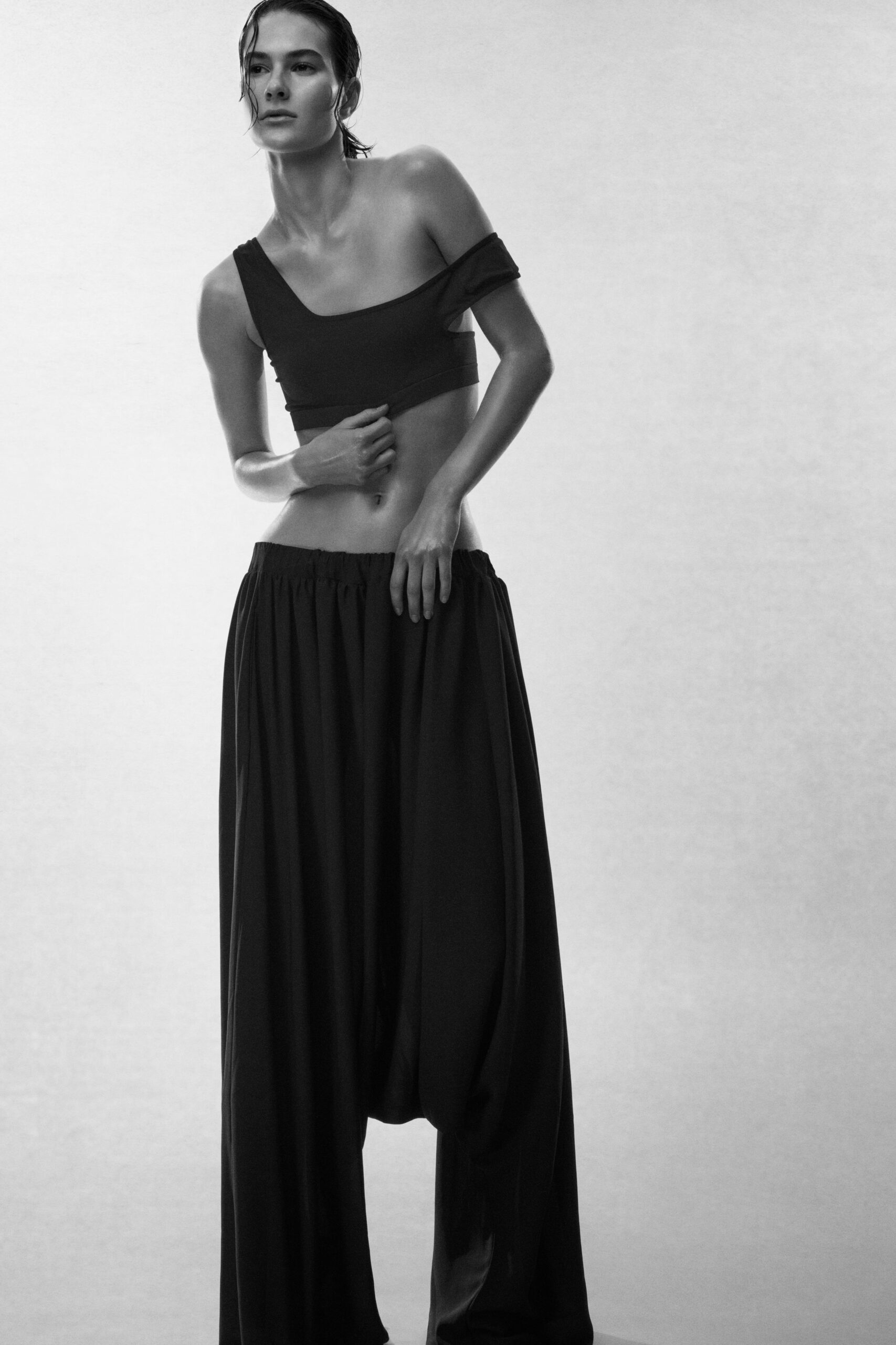 black off-shoulder top and relaxed pants