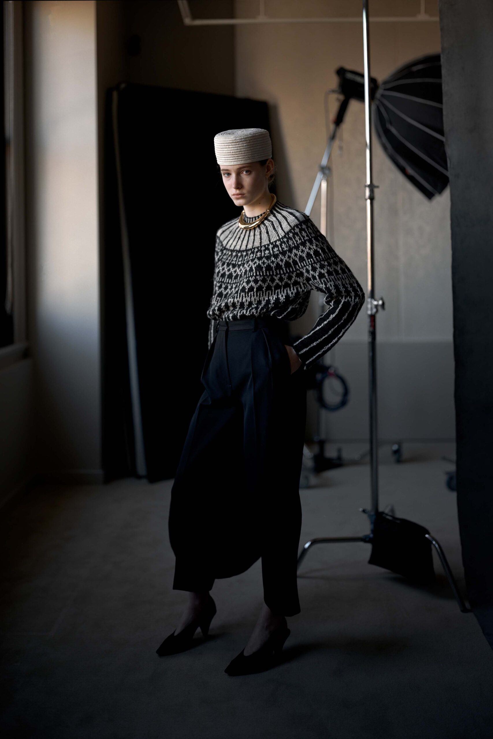 black and white embroidered sweater with relaxed pants