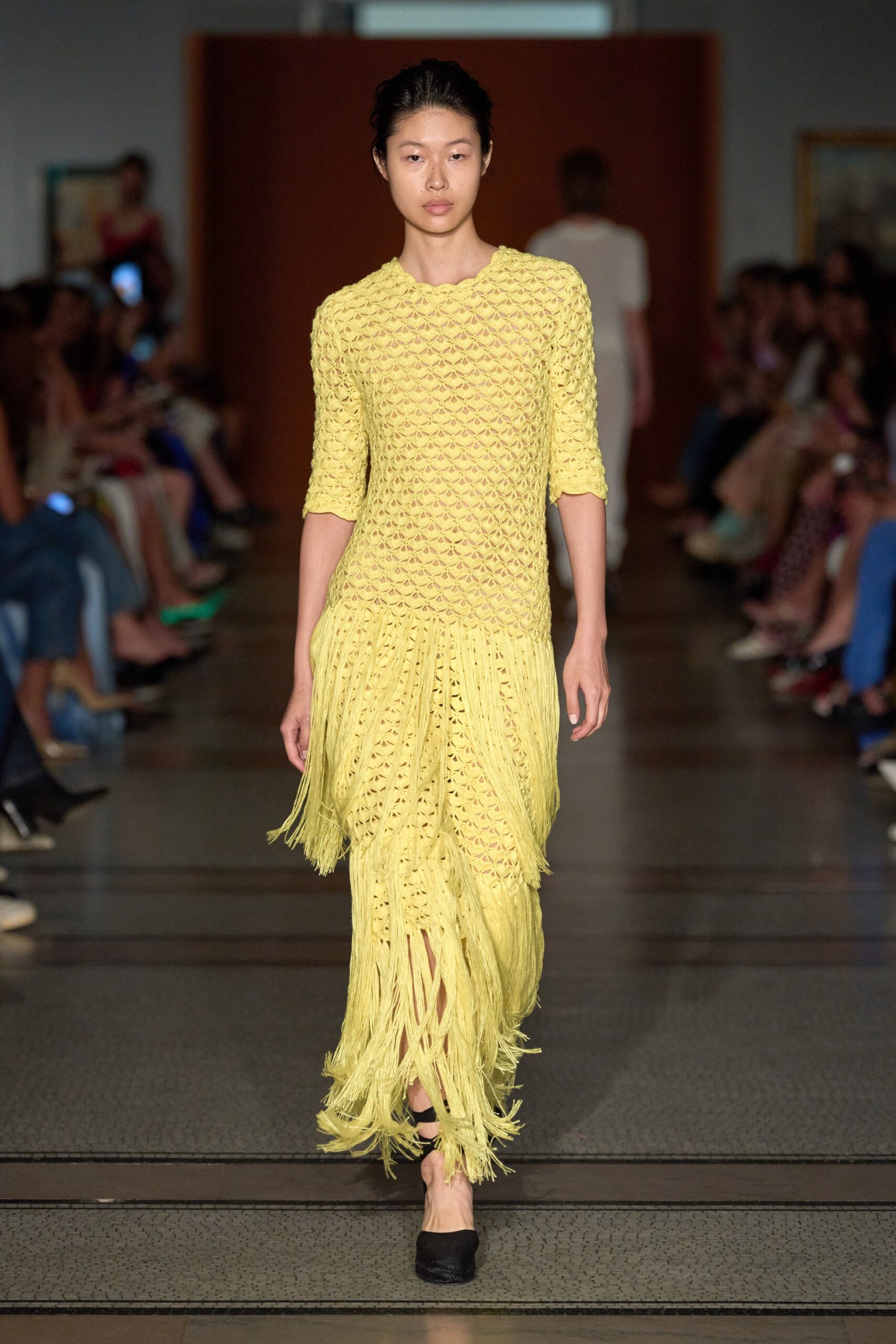 yellow fringed midi dress with black shoes
