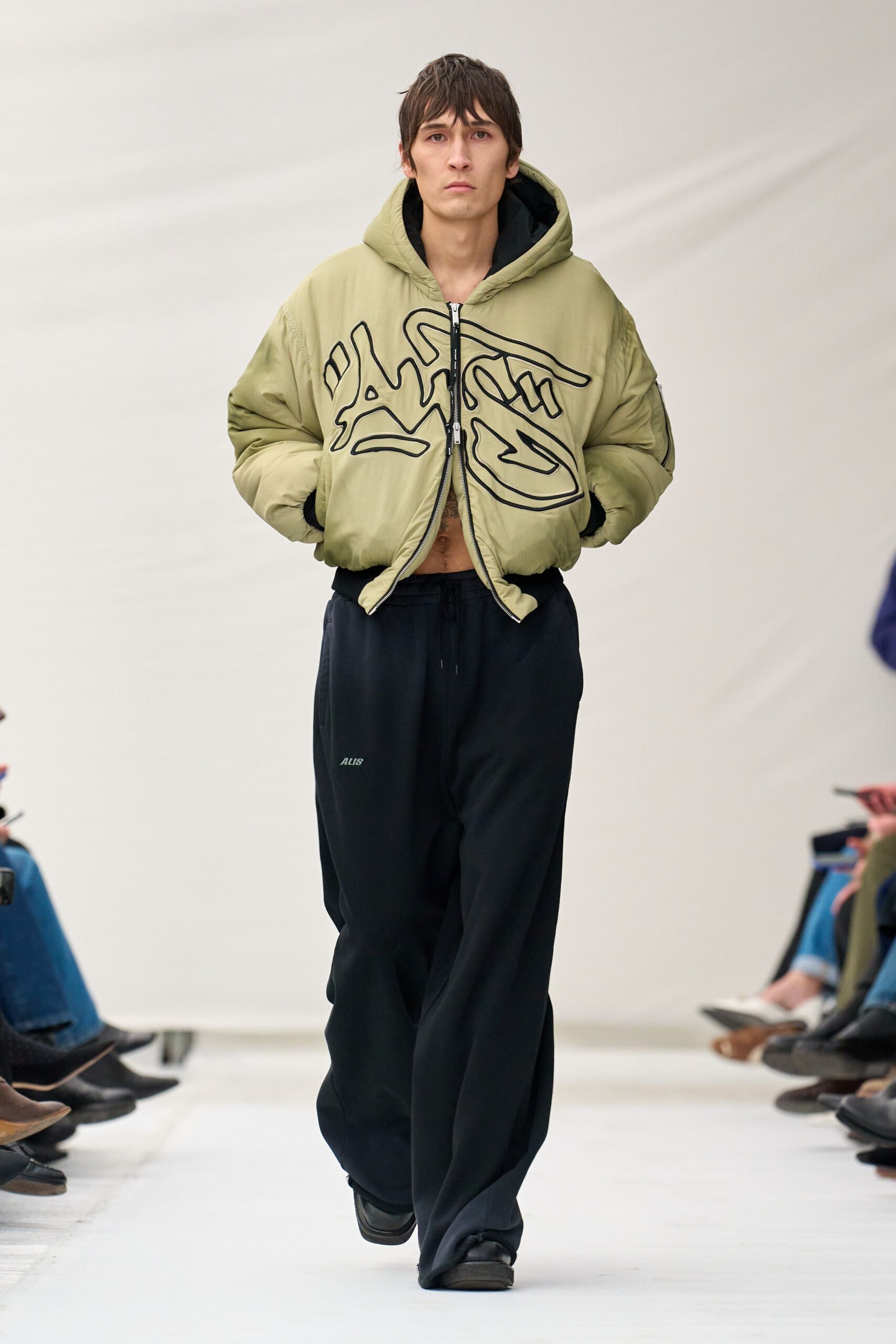 green relaxed jacket black pants