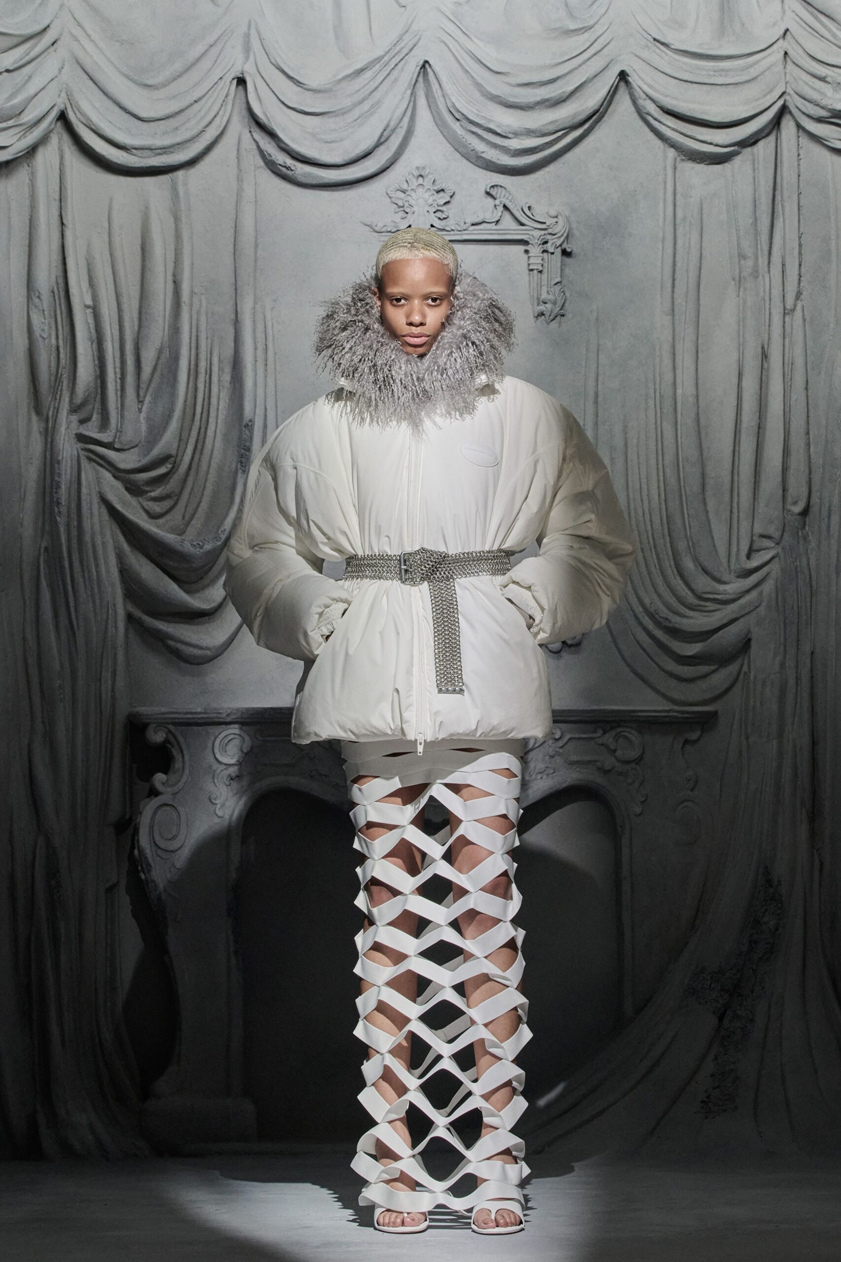 oversized white coat with cutout pants