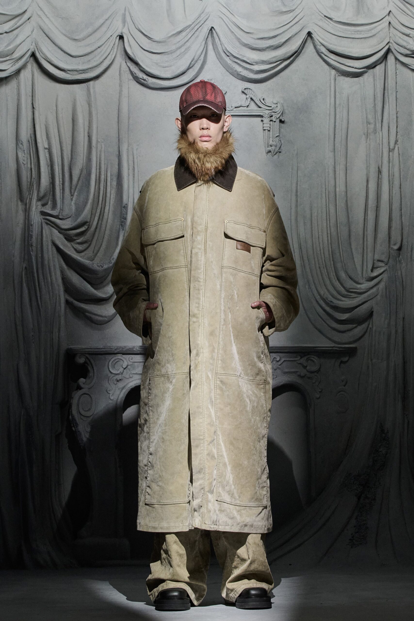 beige leather coat with black pants
