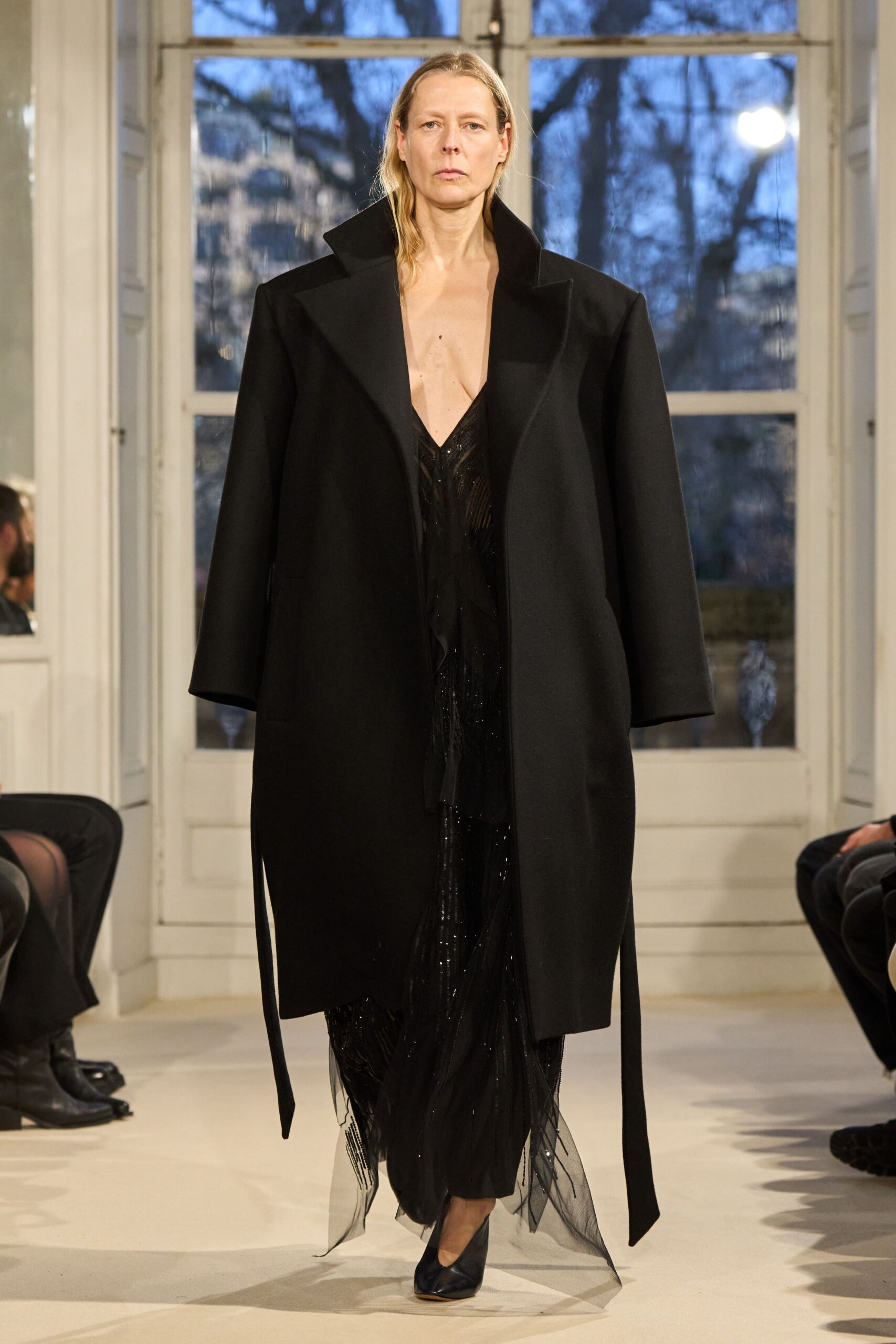 black wool coat and black silk dress