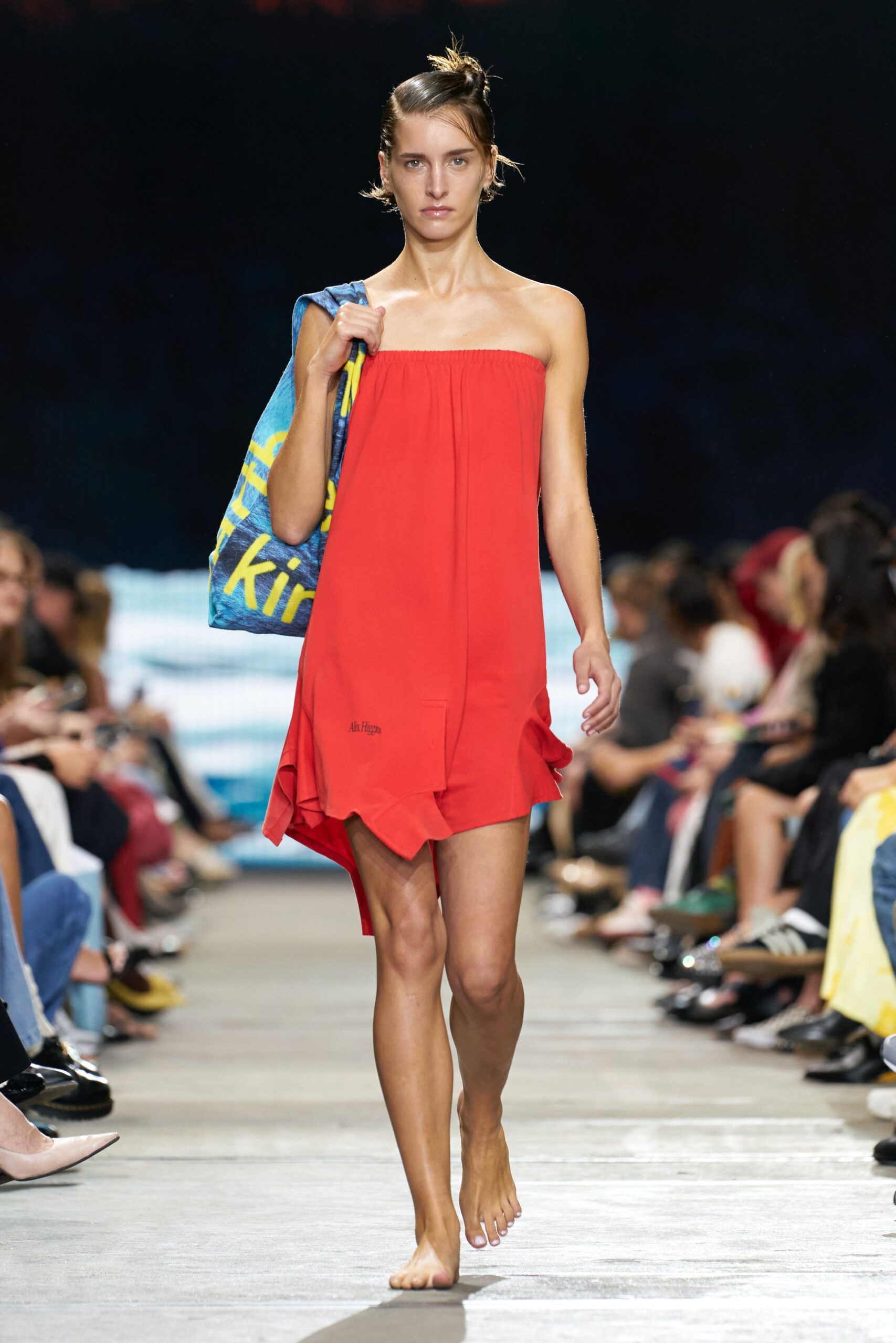 red strapless tiered dress with bag