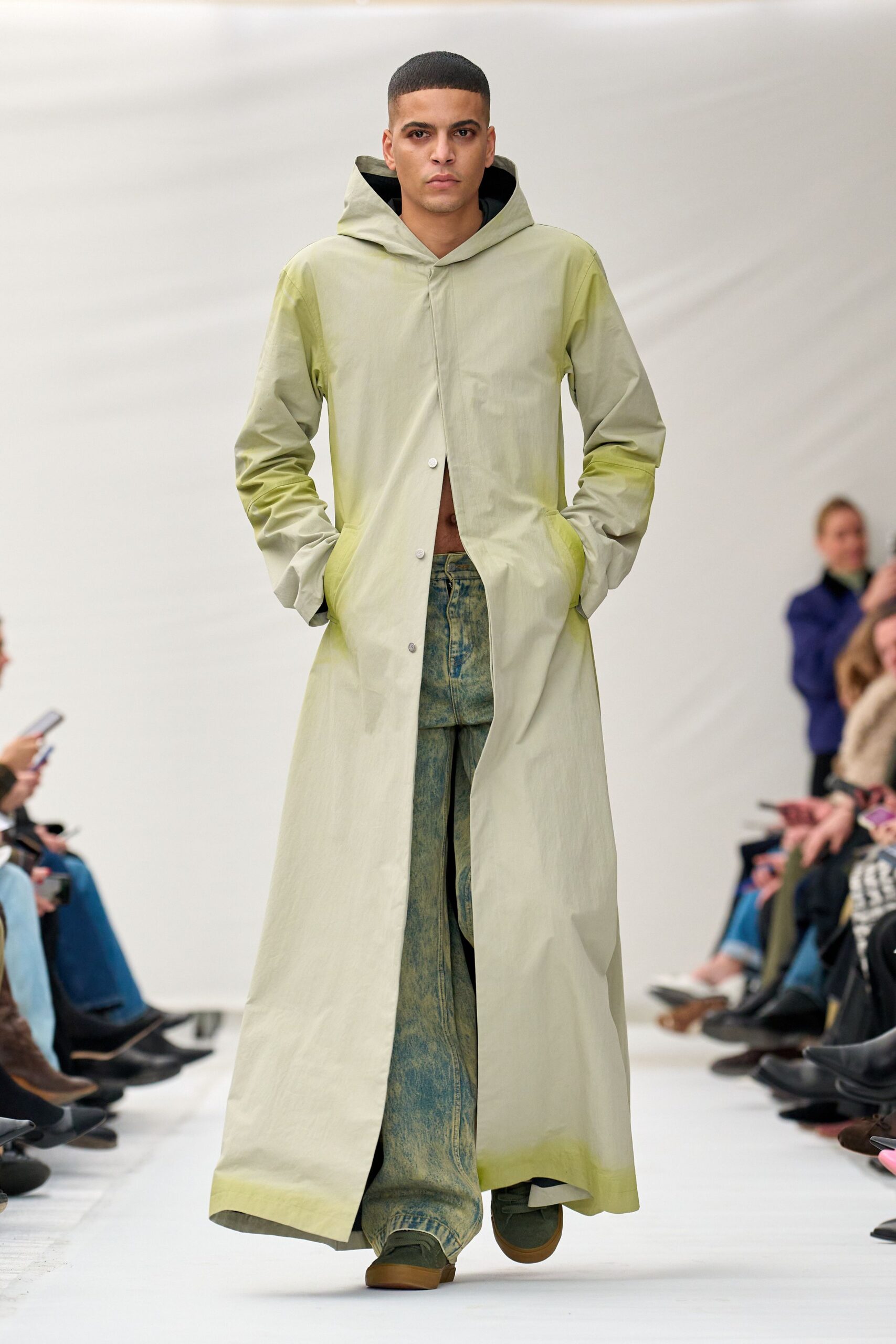 green coat with denim pants