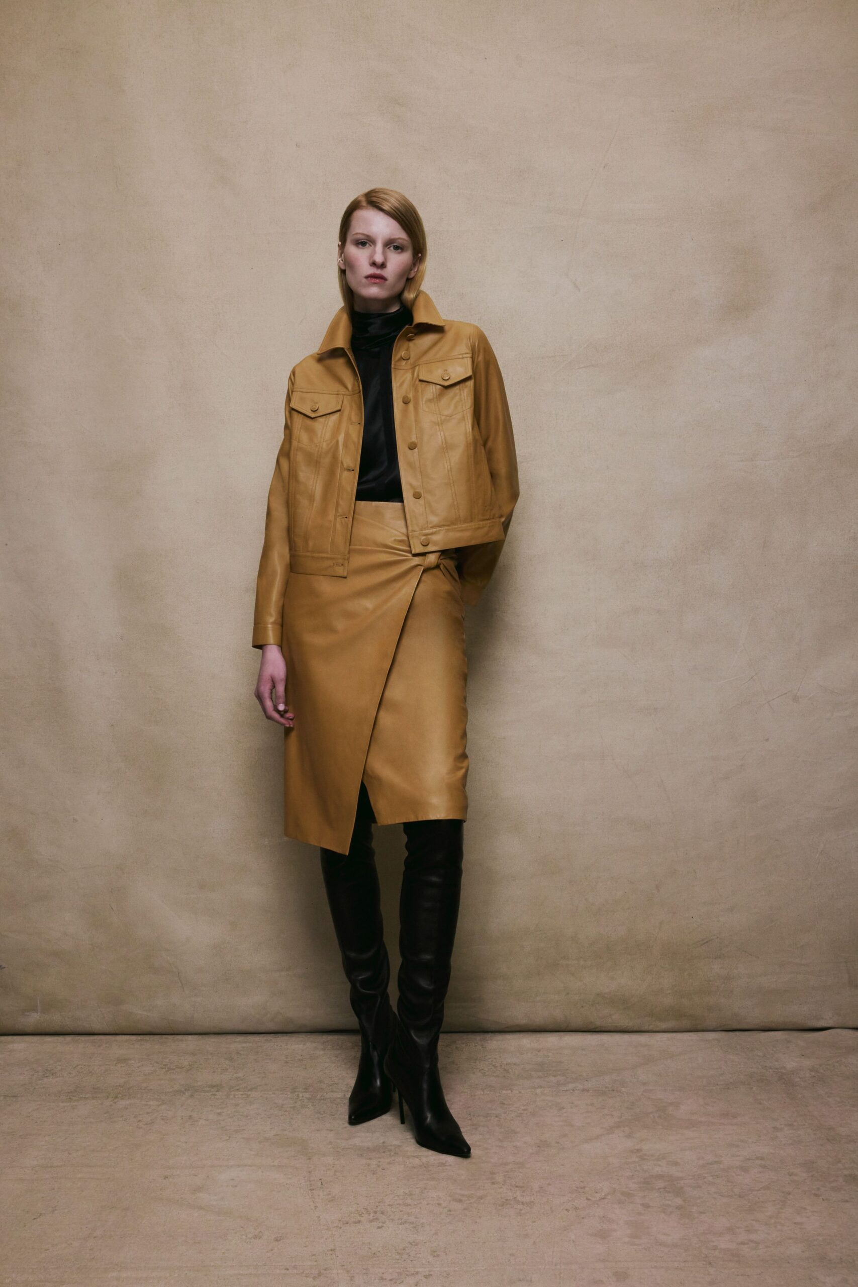 brown leather jacket with black top