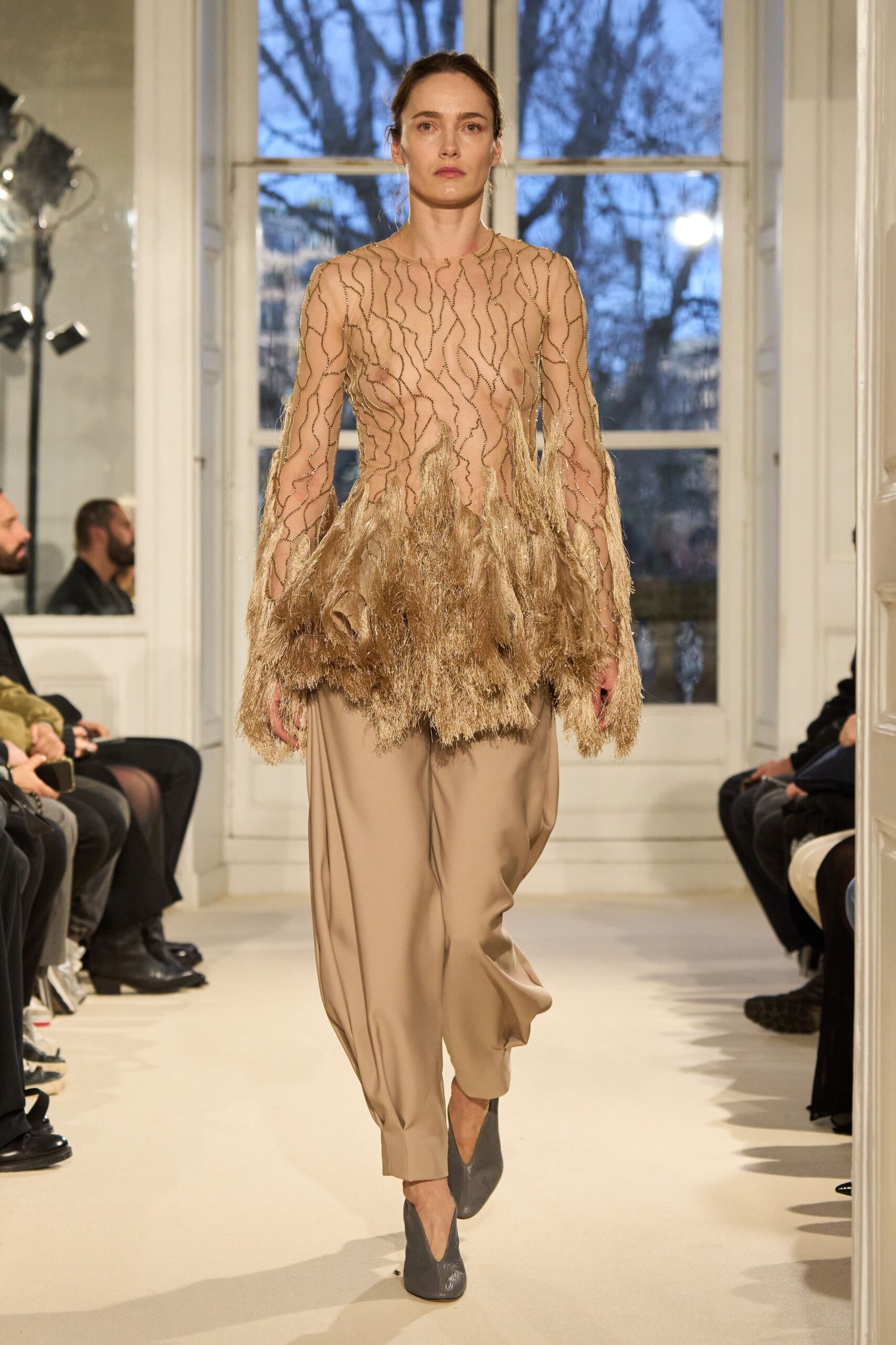 beige ruffled top with relaxed pants