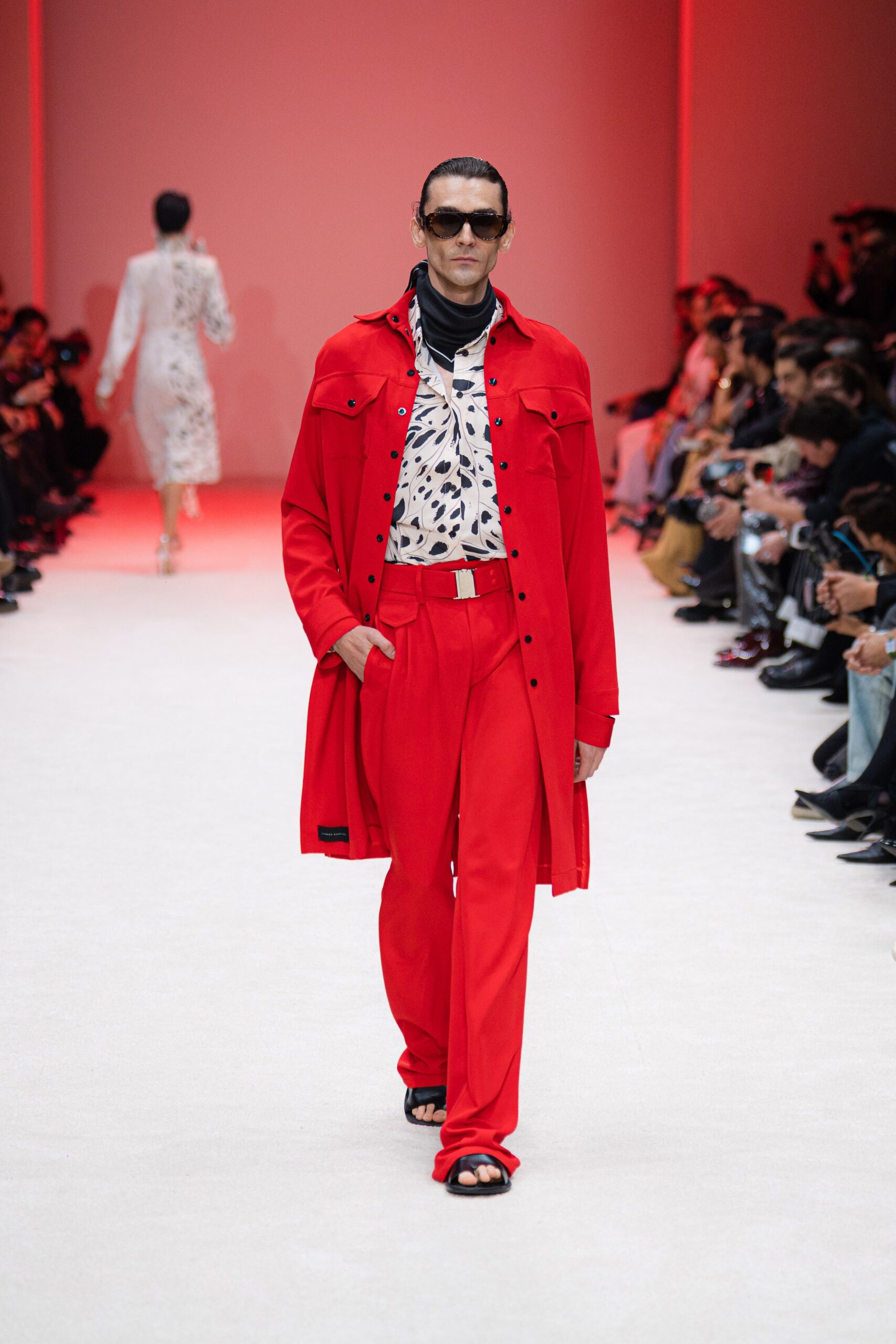 red coat with printed shirt