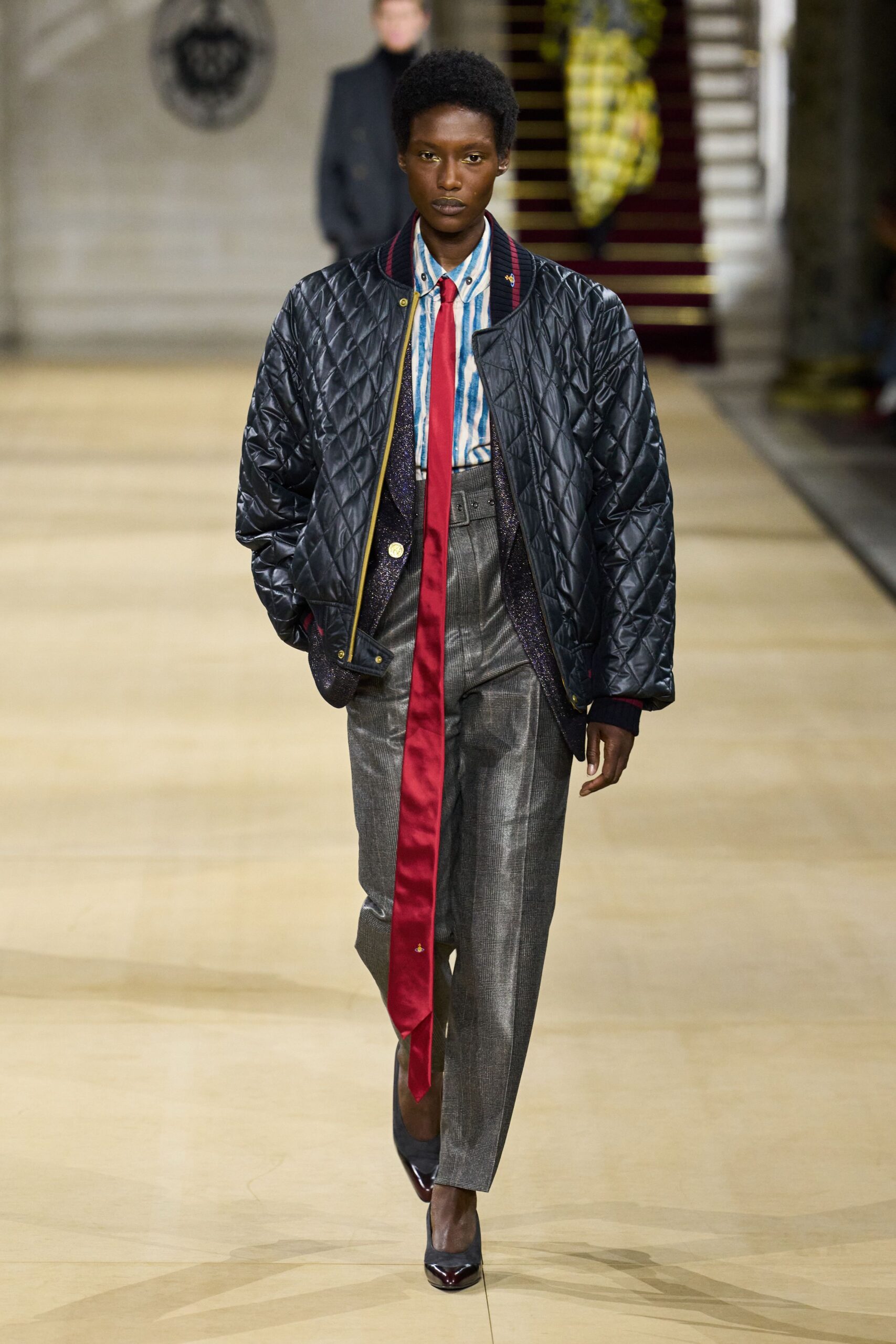 black quilted jacket with striped shirt