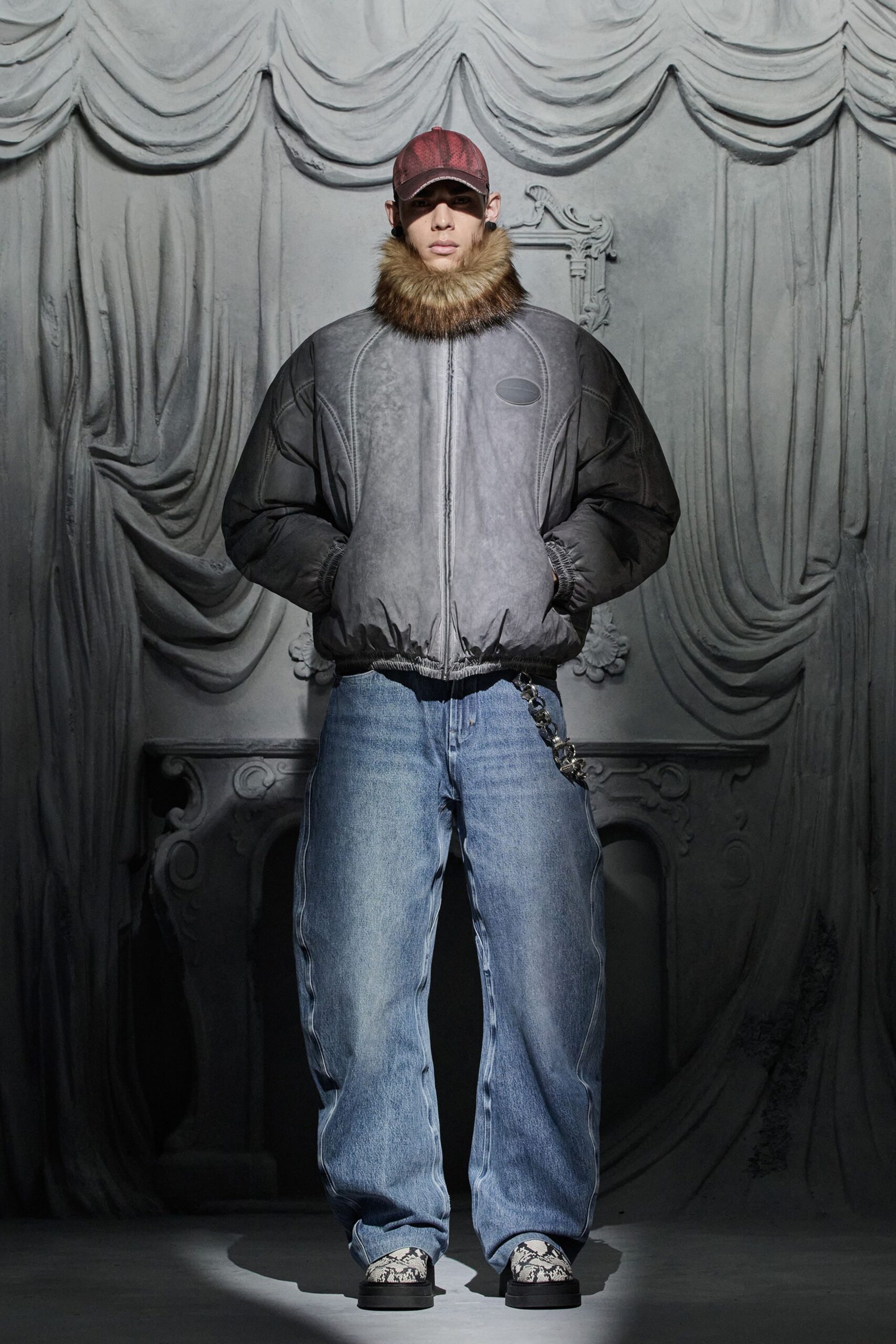 black leather relaxed jacket with blue denim pants