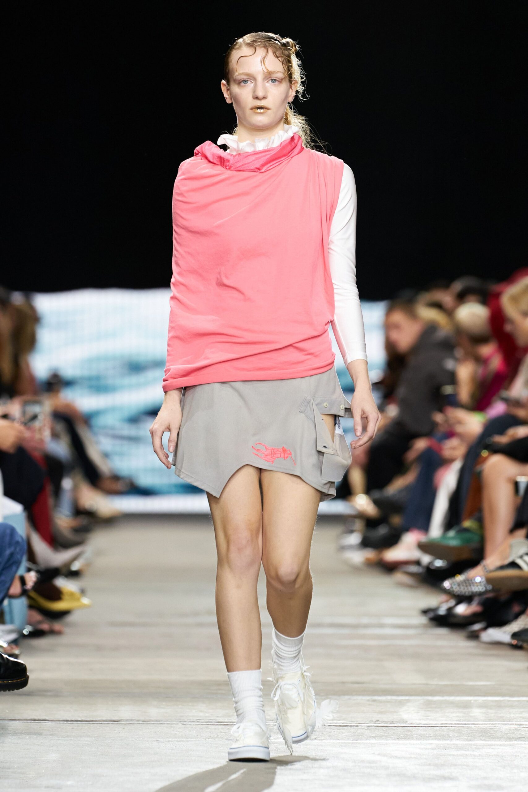 pink top gray skirt white shoes