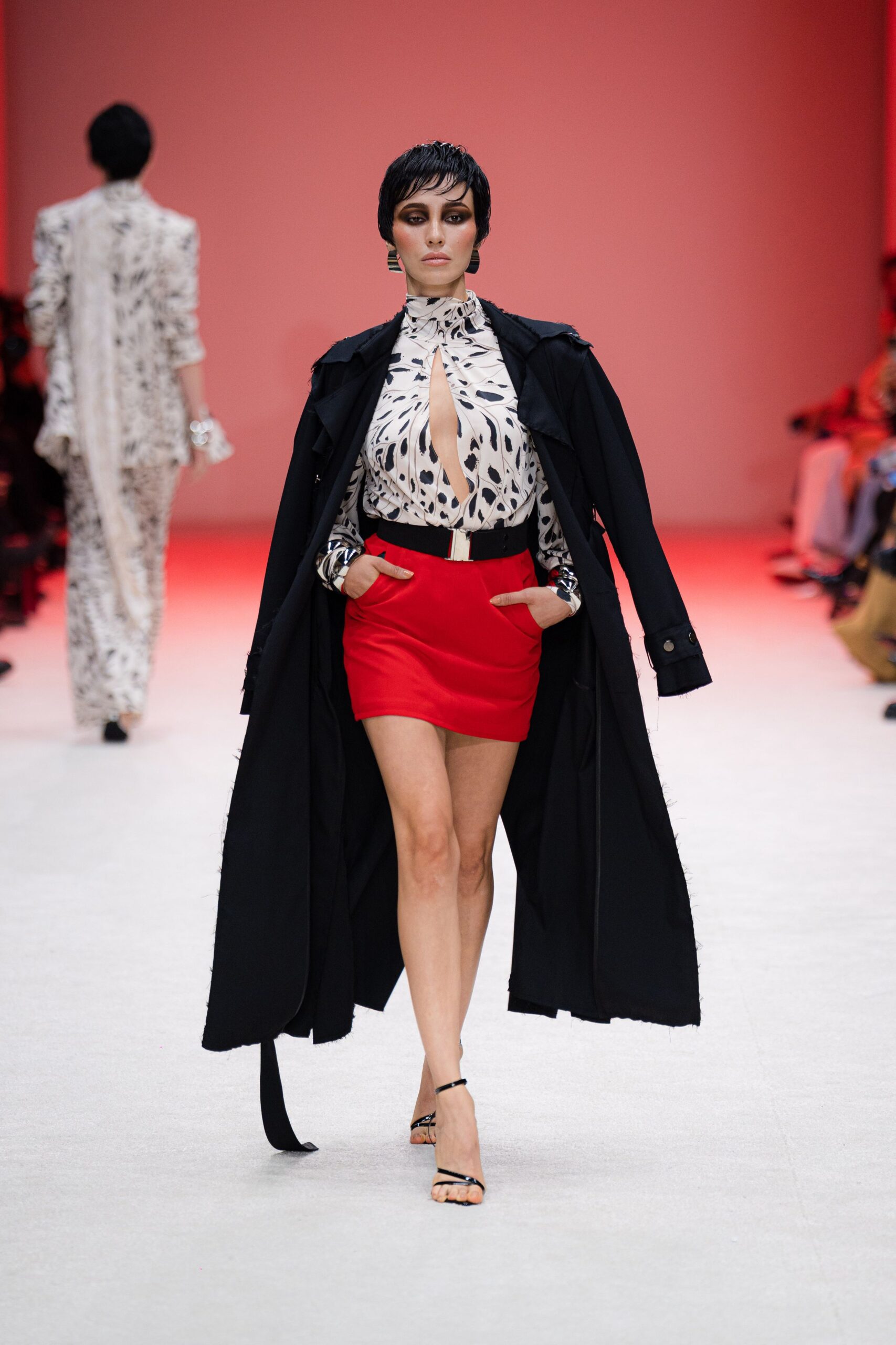 black coat white blouse red skirt