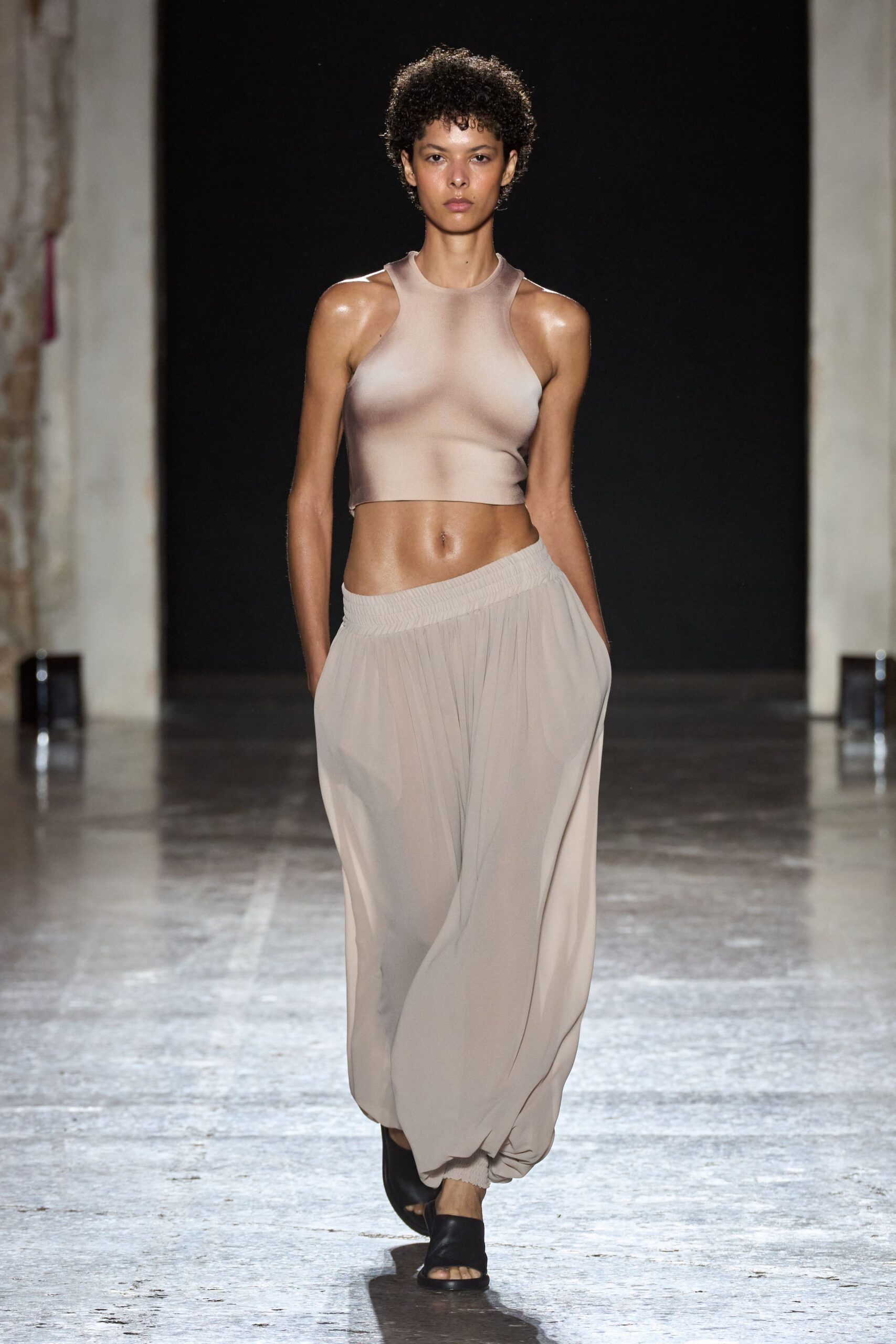 beige silk sleeveless top with relaxed pants