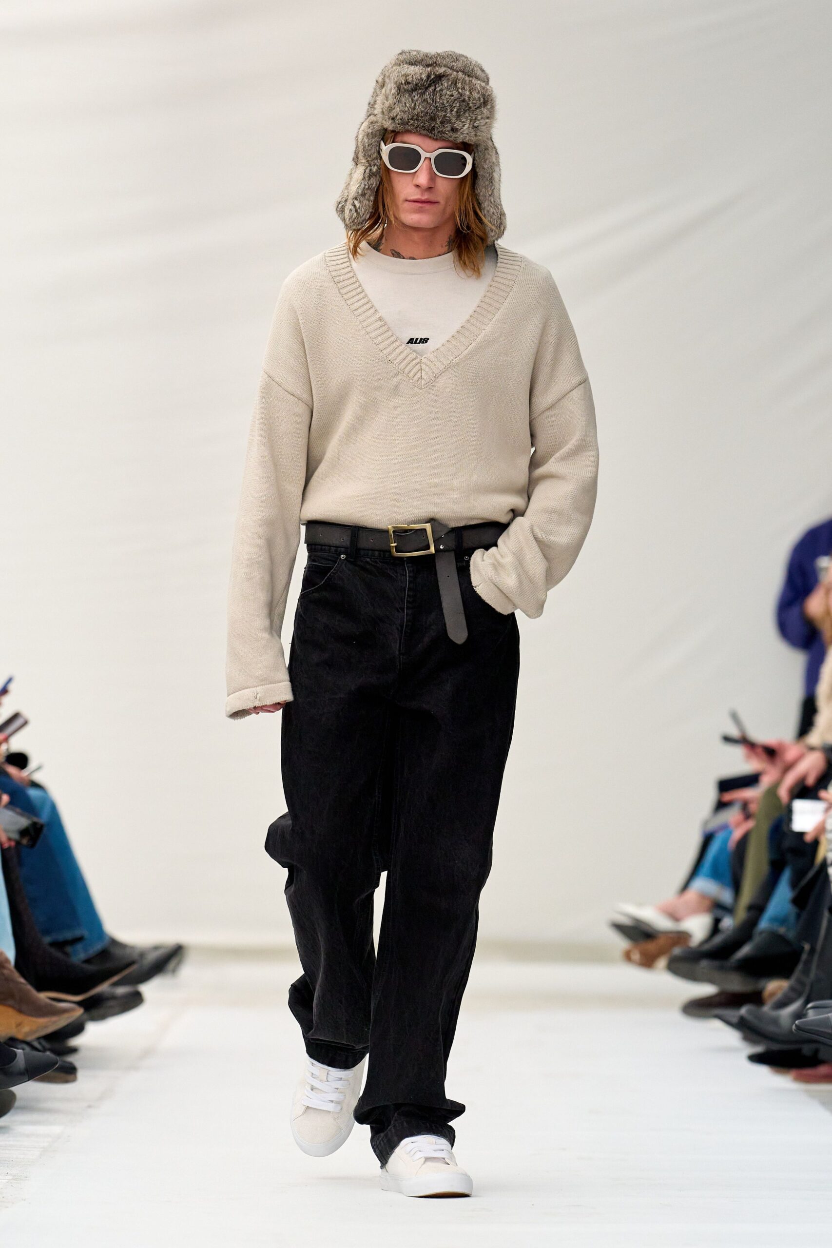 beige relaxed sweater with black pants