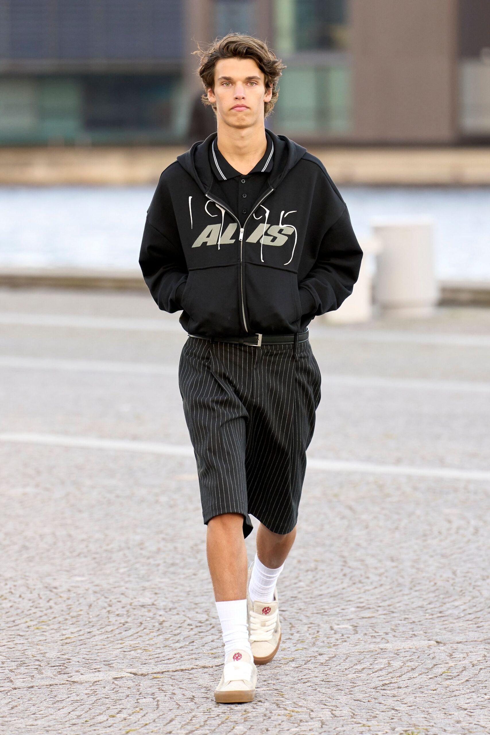 black hoodie with striped shorts