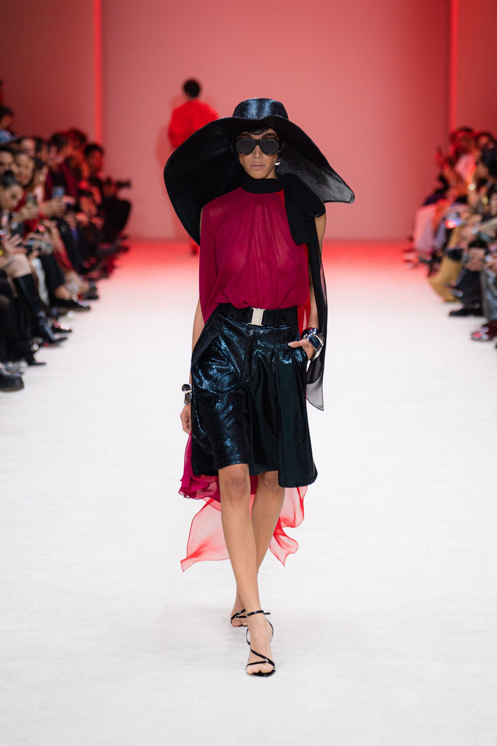 red silk sleeveless high-neck fitted draped flowing top
