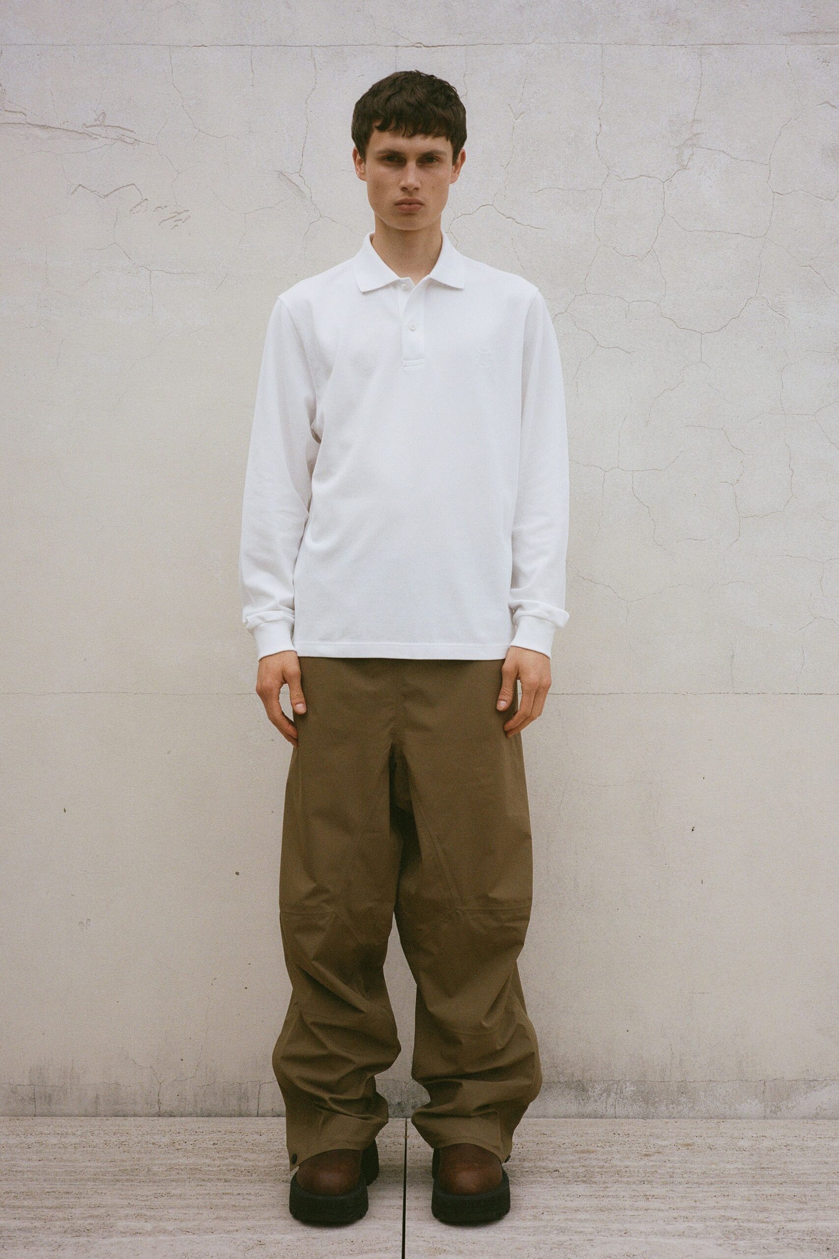 white relaxed shirt with brown pants