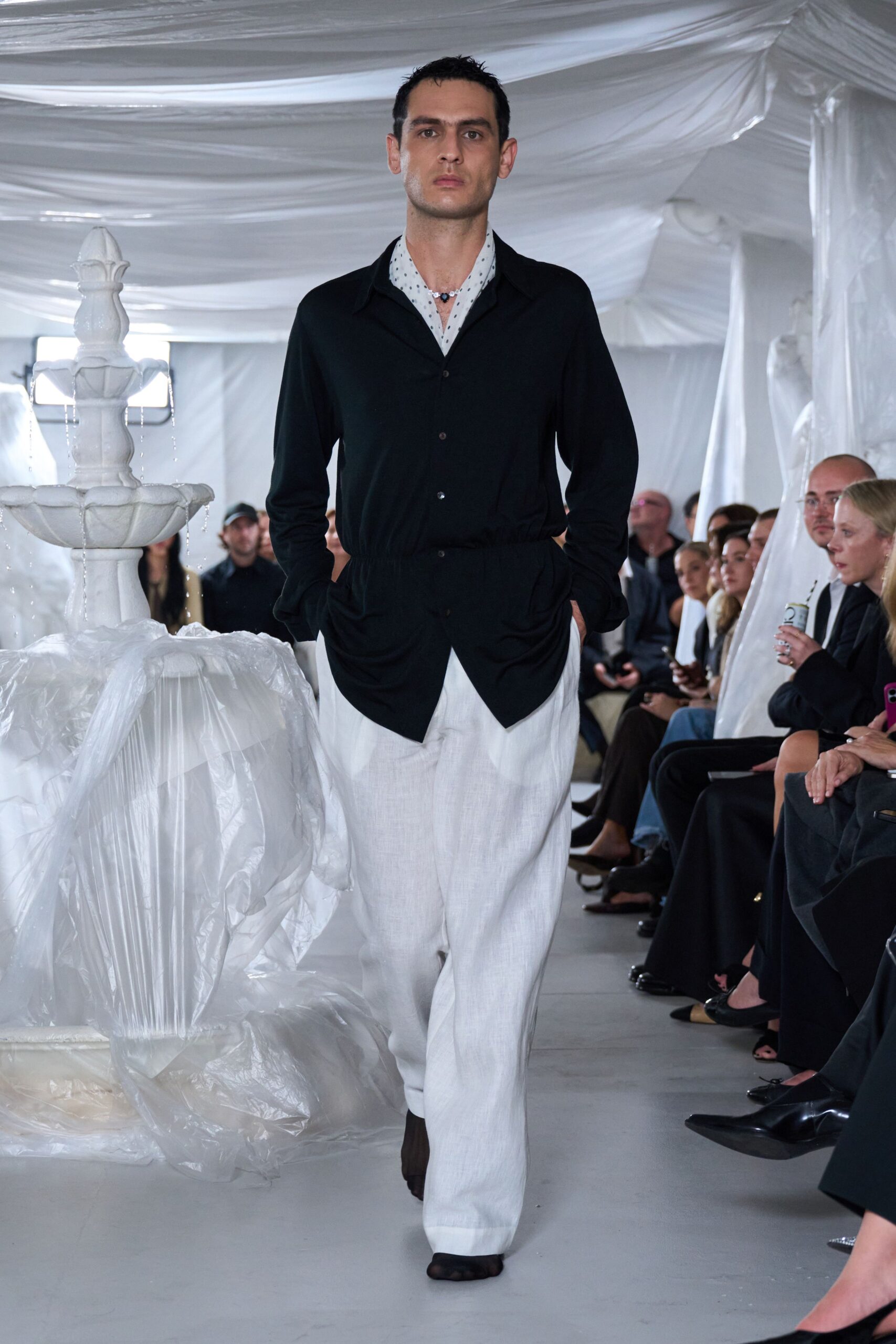 black shirt white pants