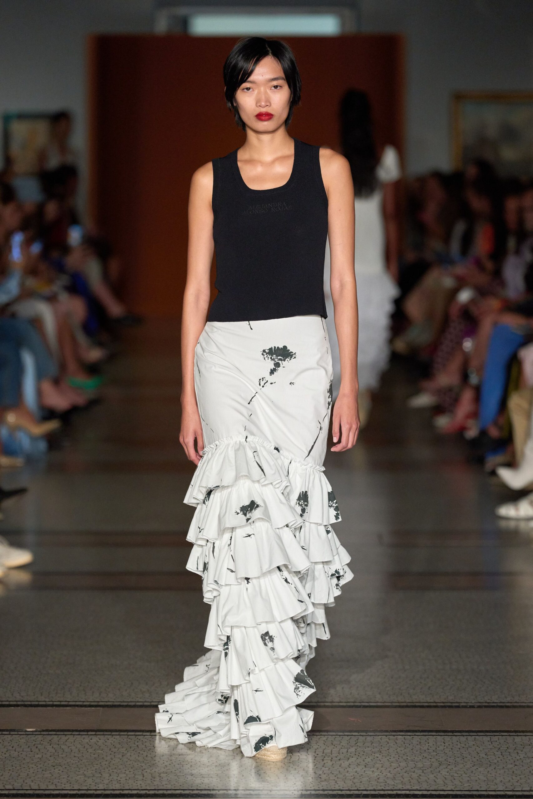 black tank-top and white tiered skirt