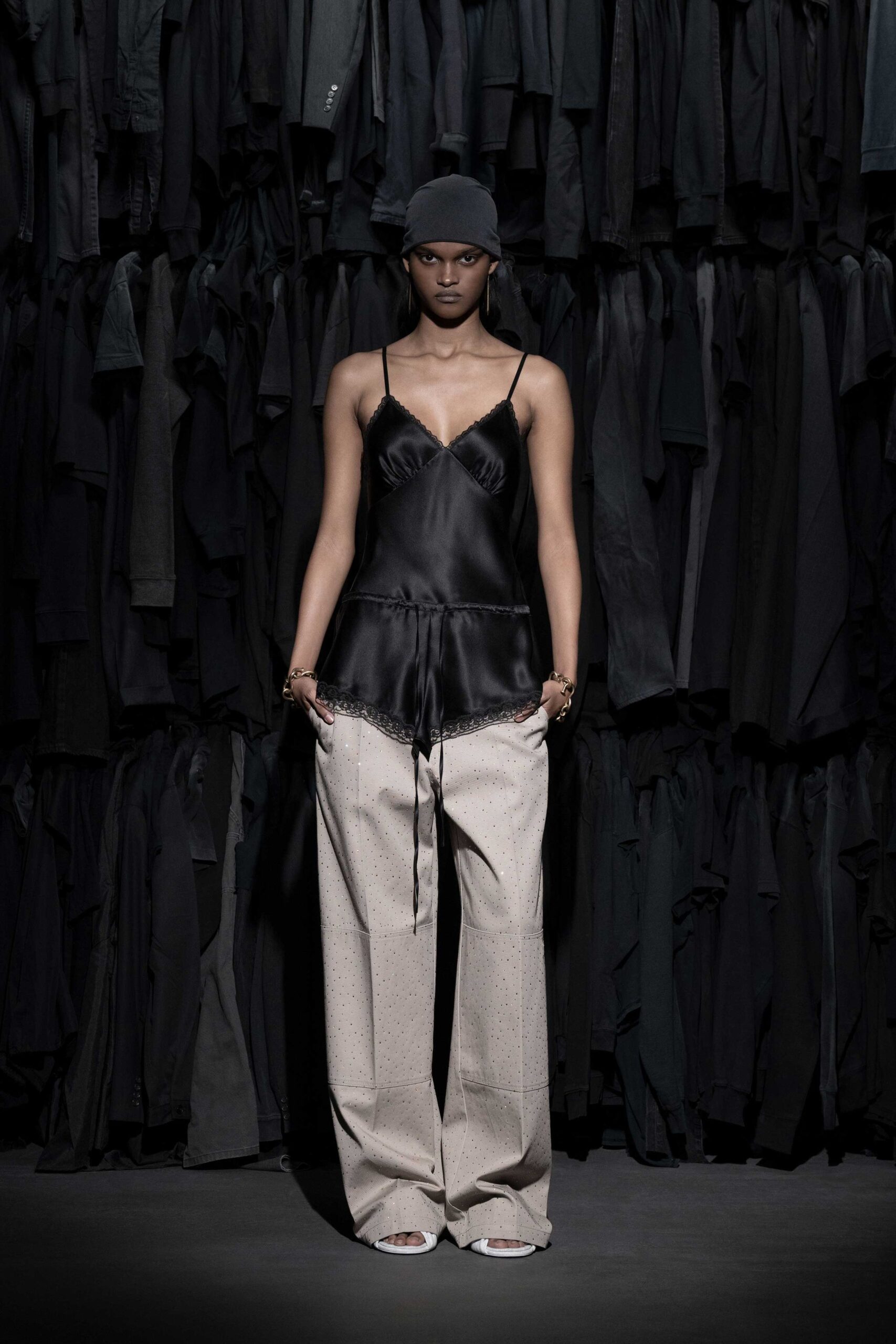 black silk top beige wide-leg pants