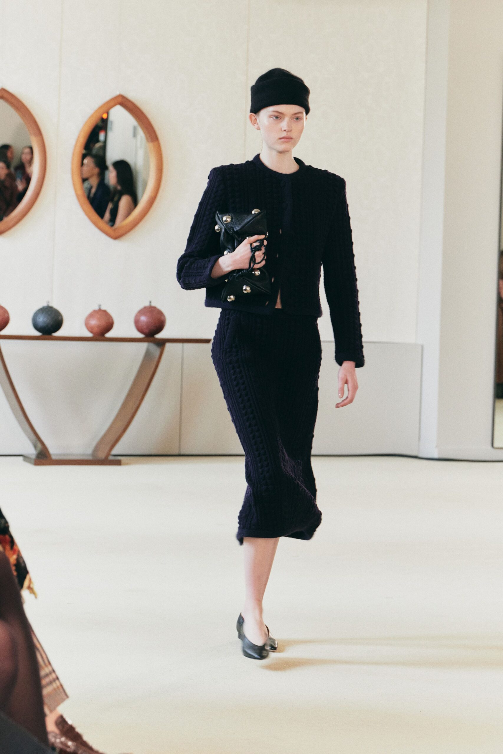 black fitted midi skirt and jacket