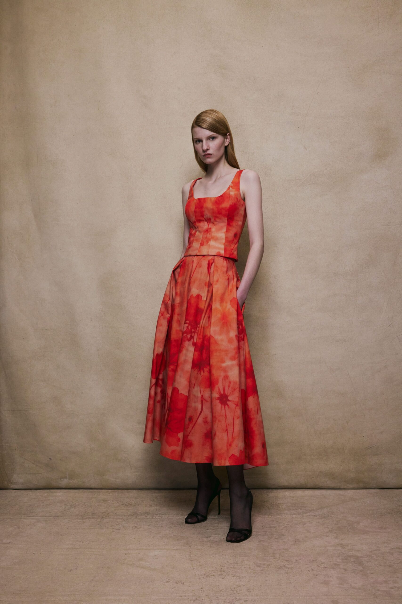 red orange midi dress with black shoes