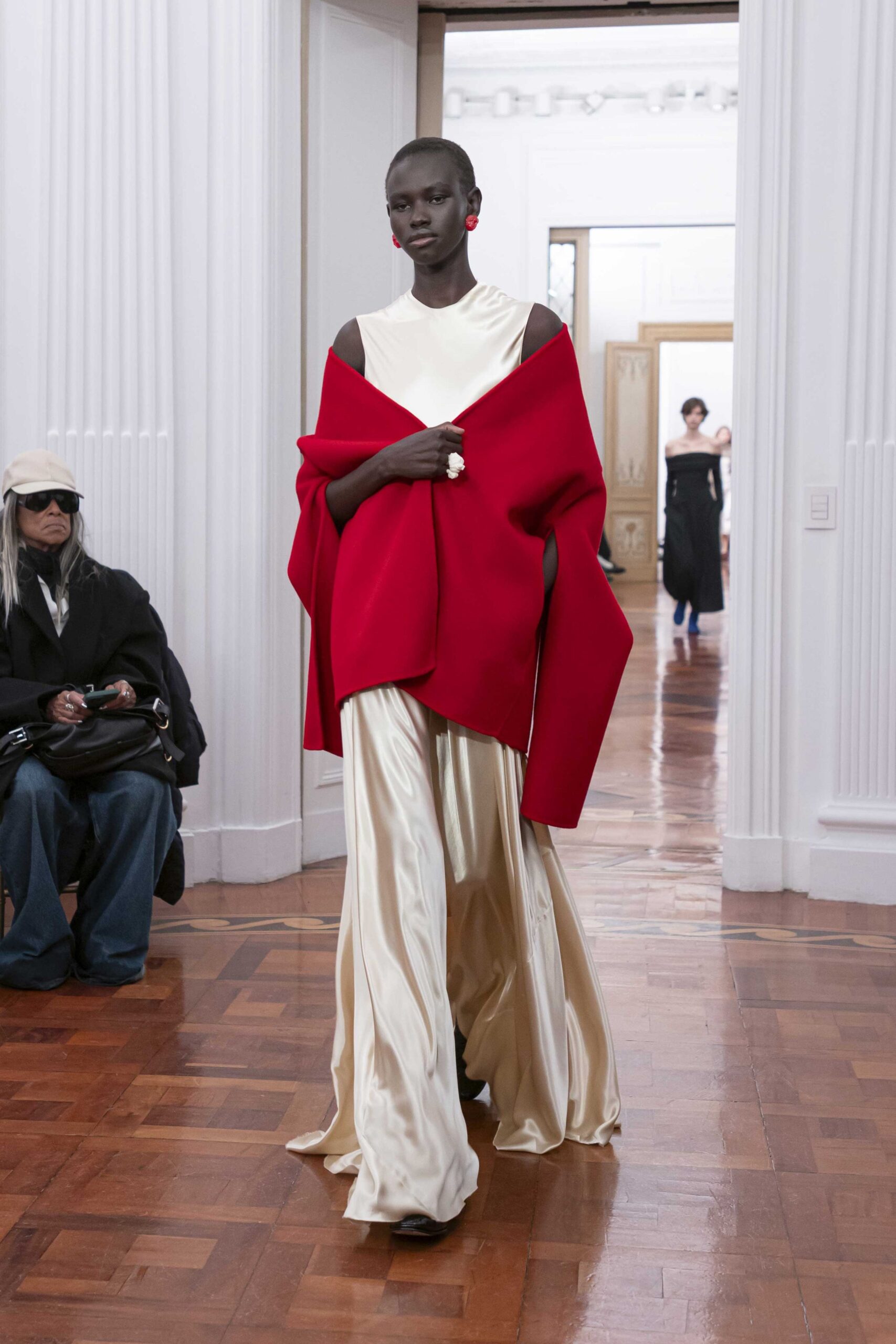 gold silk gown with red cape