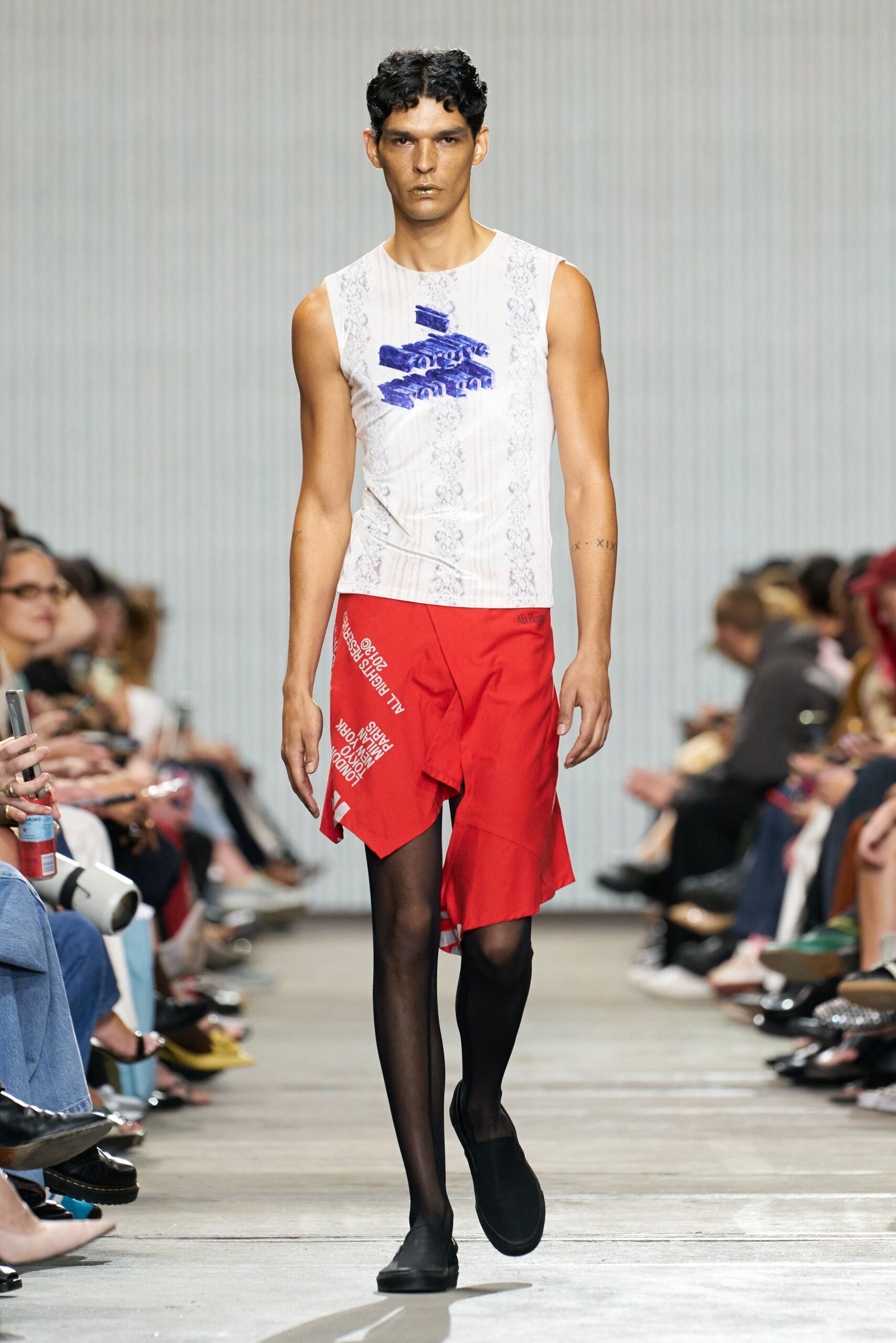 white fitted sleeveless top with red shorts