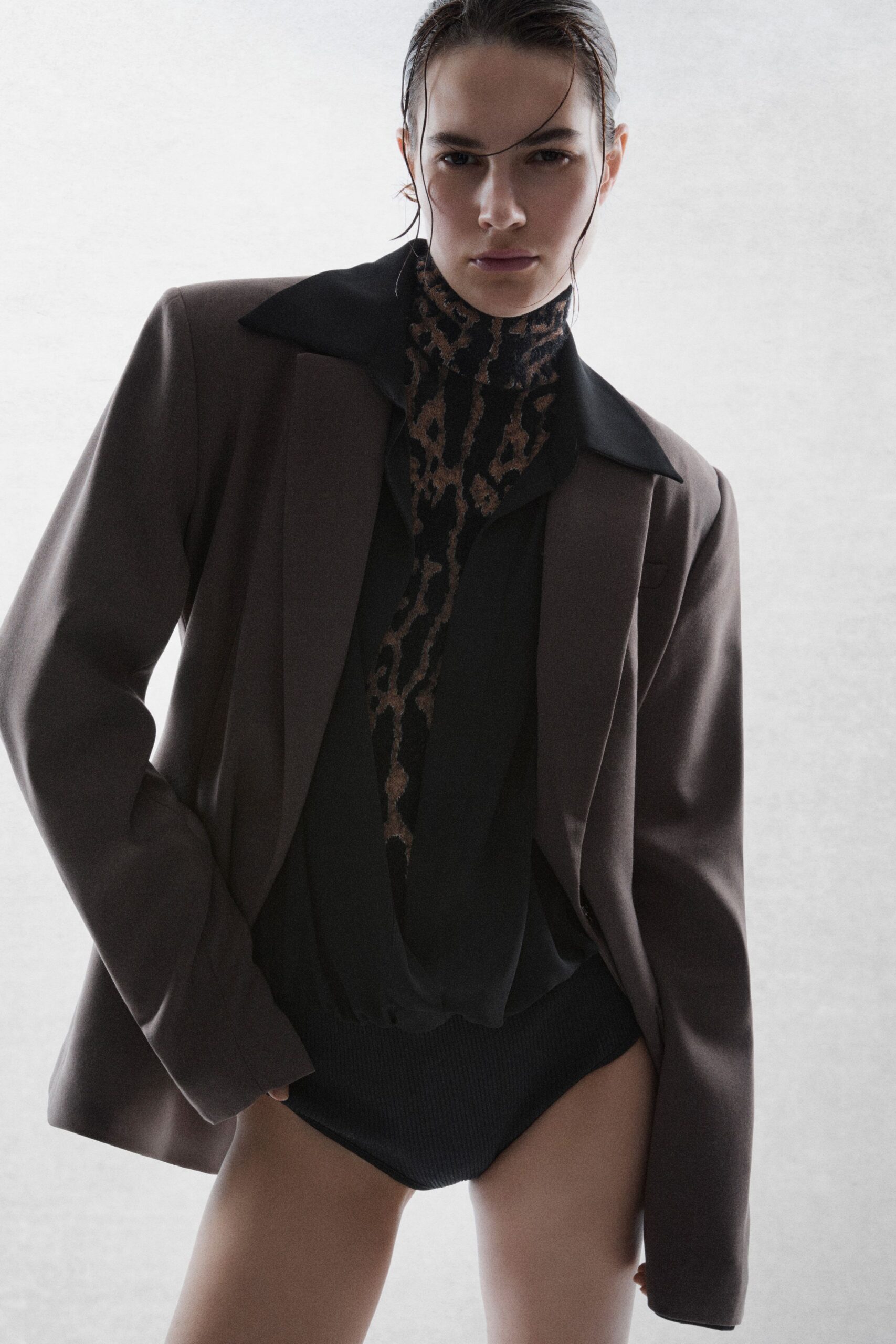 brown structured blazer and black bodysuit