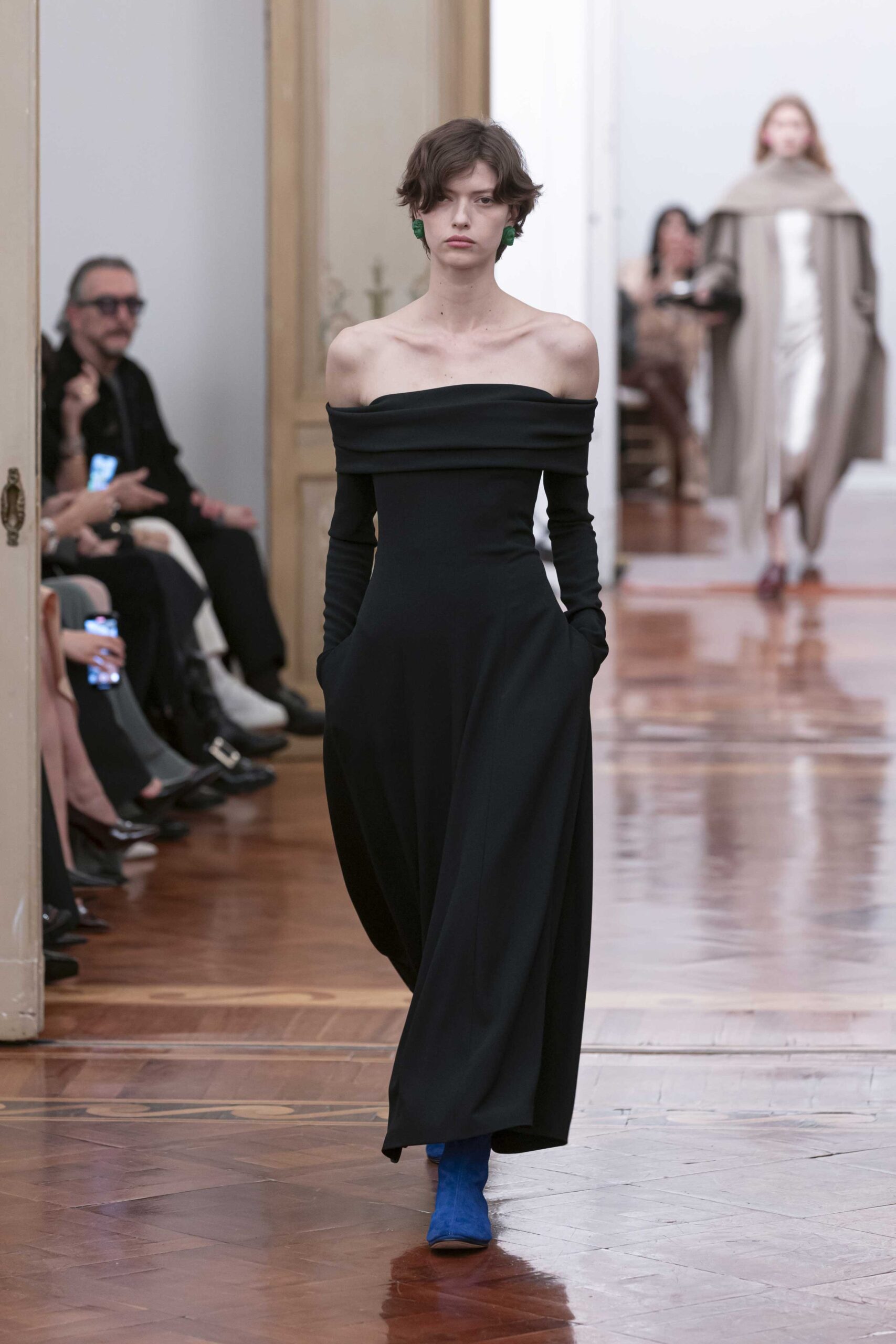black off-shoulder gown with blue boots