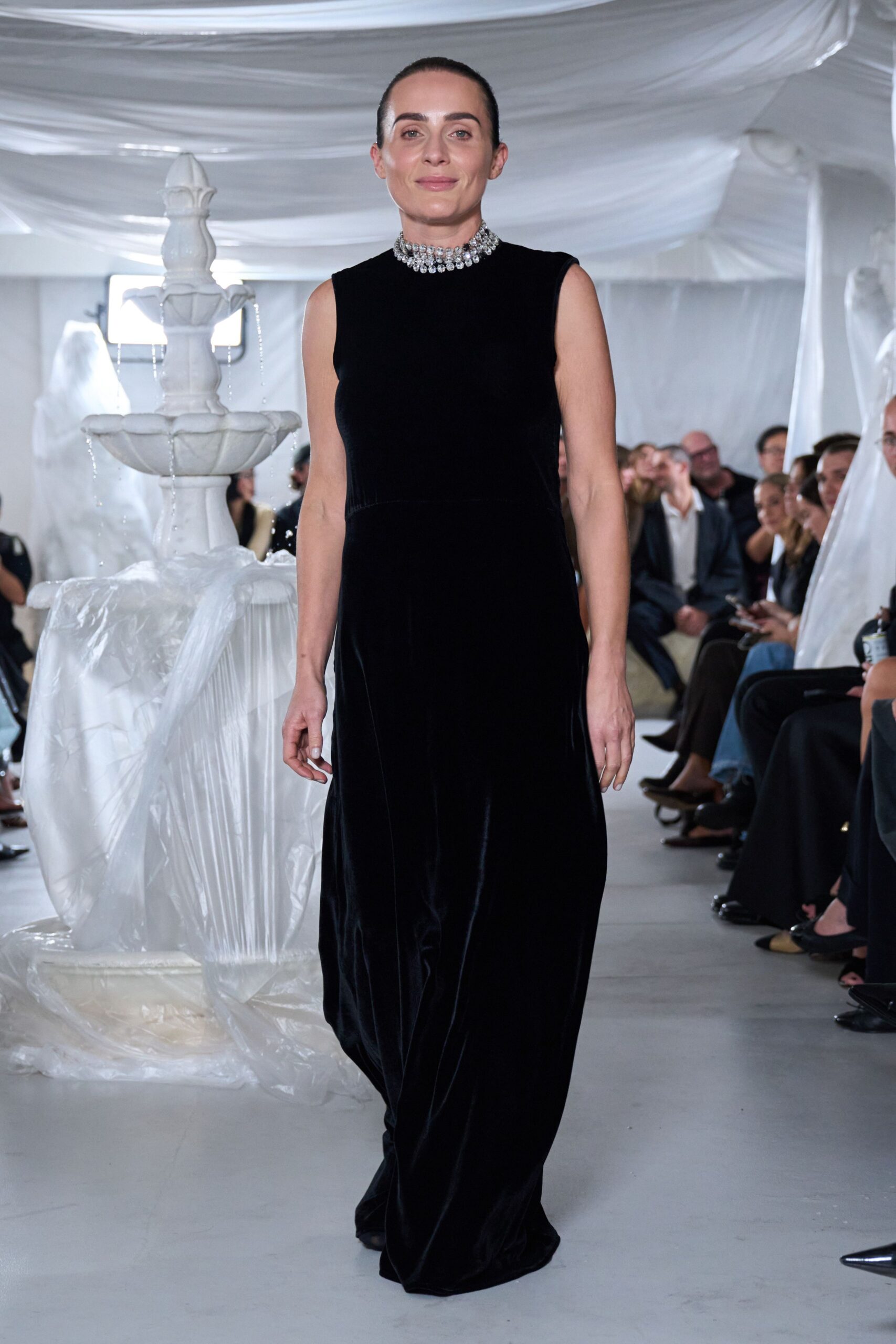 black sleeveless velvet gown