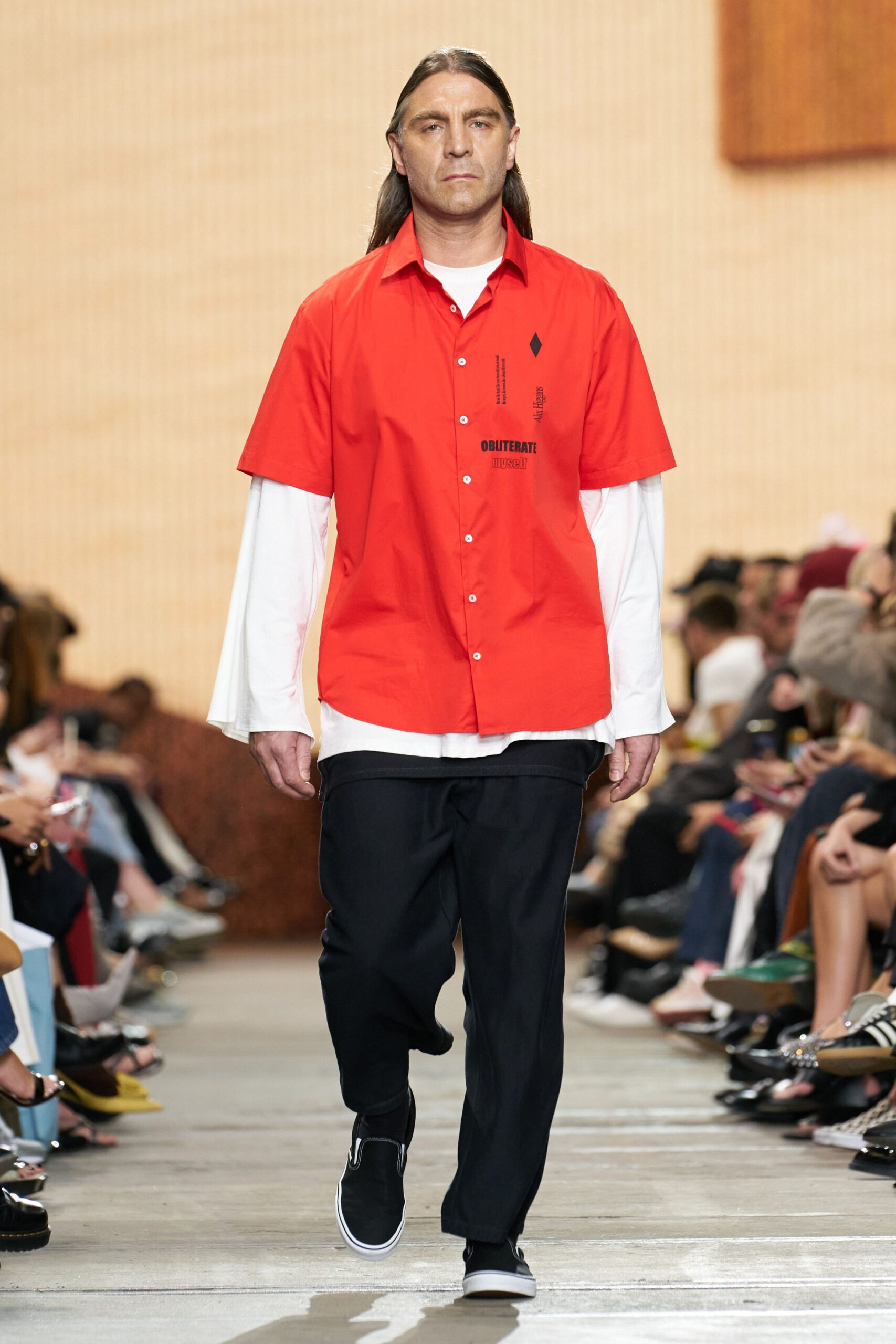 red and white relaxed shirt with black pants