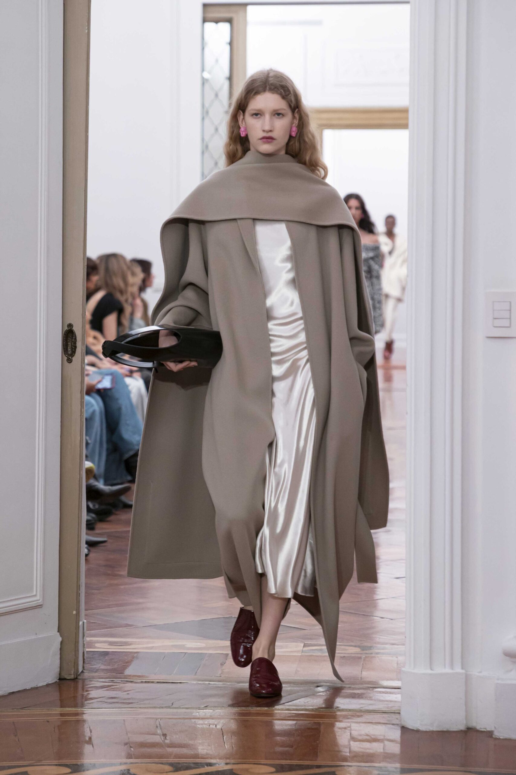 beige oversized coat with white dress