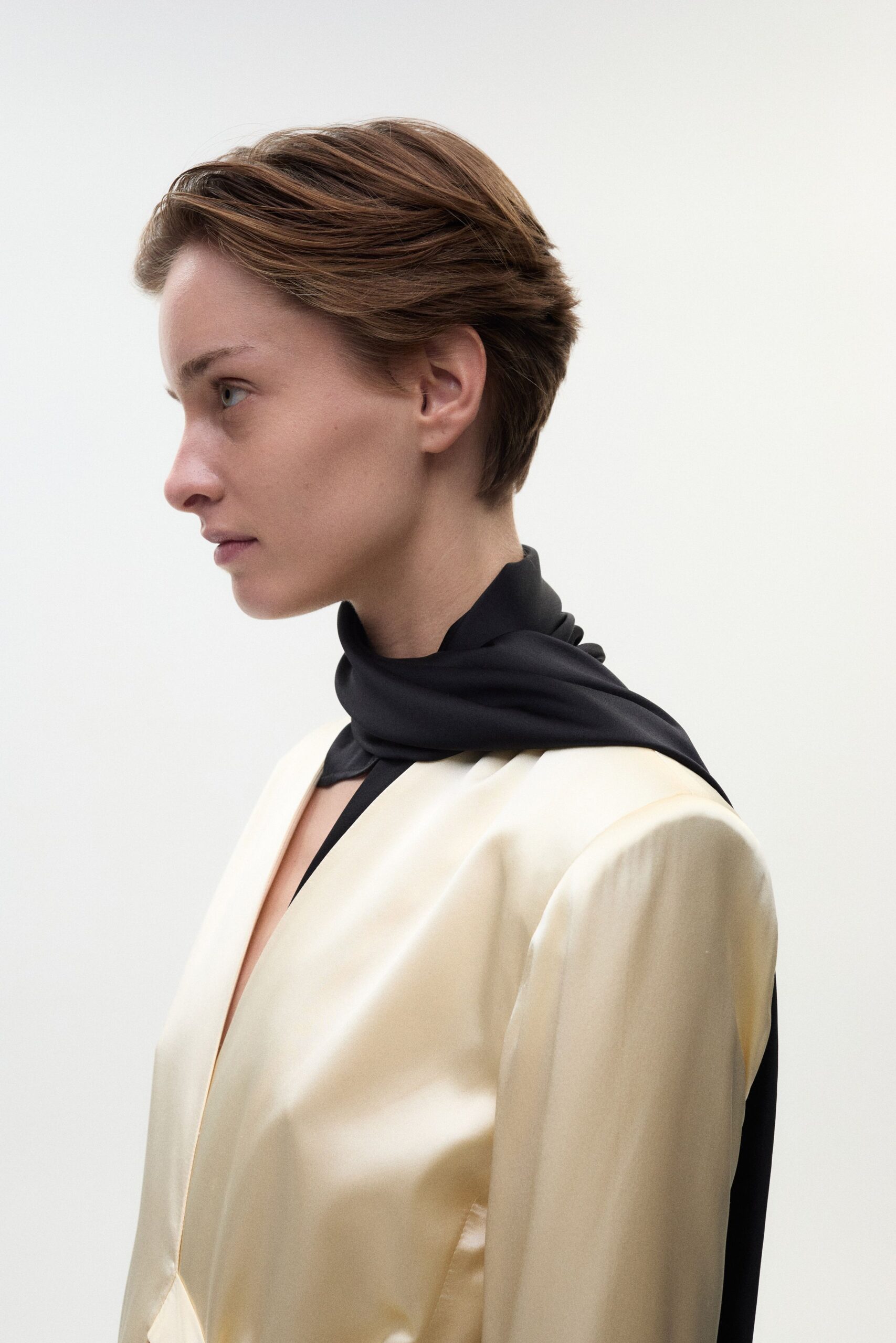gold silk fitted blazer with black scarf