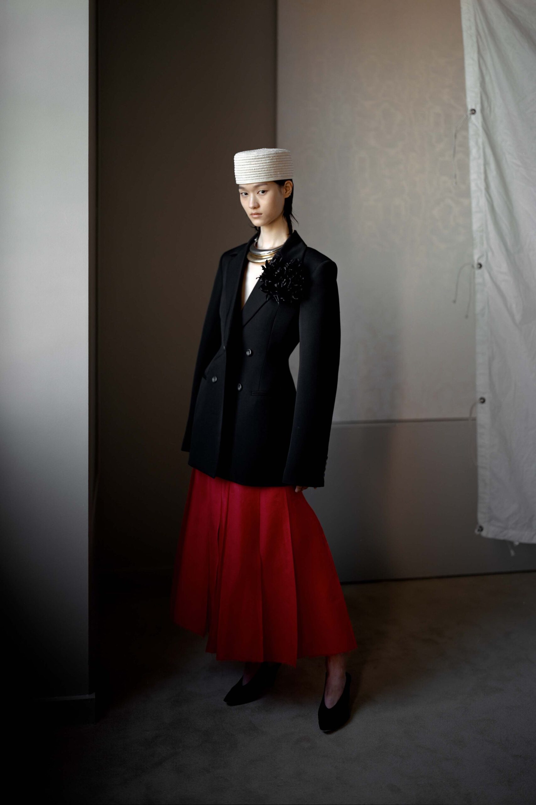 black blazer red pleated skirt