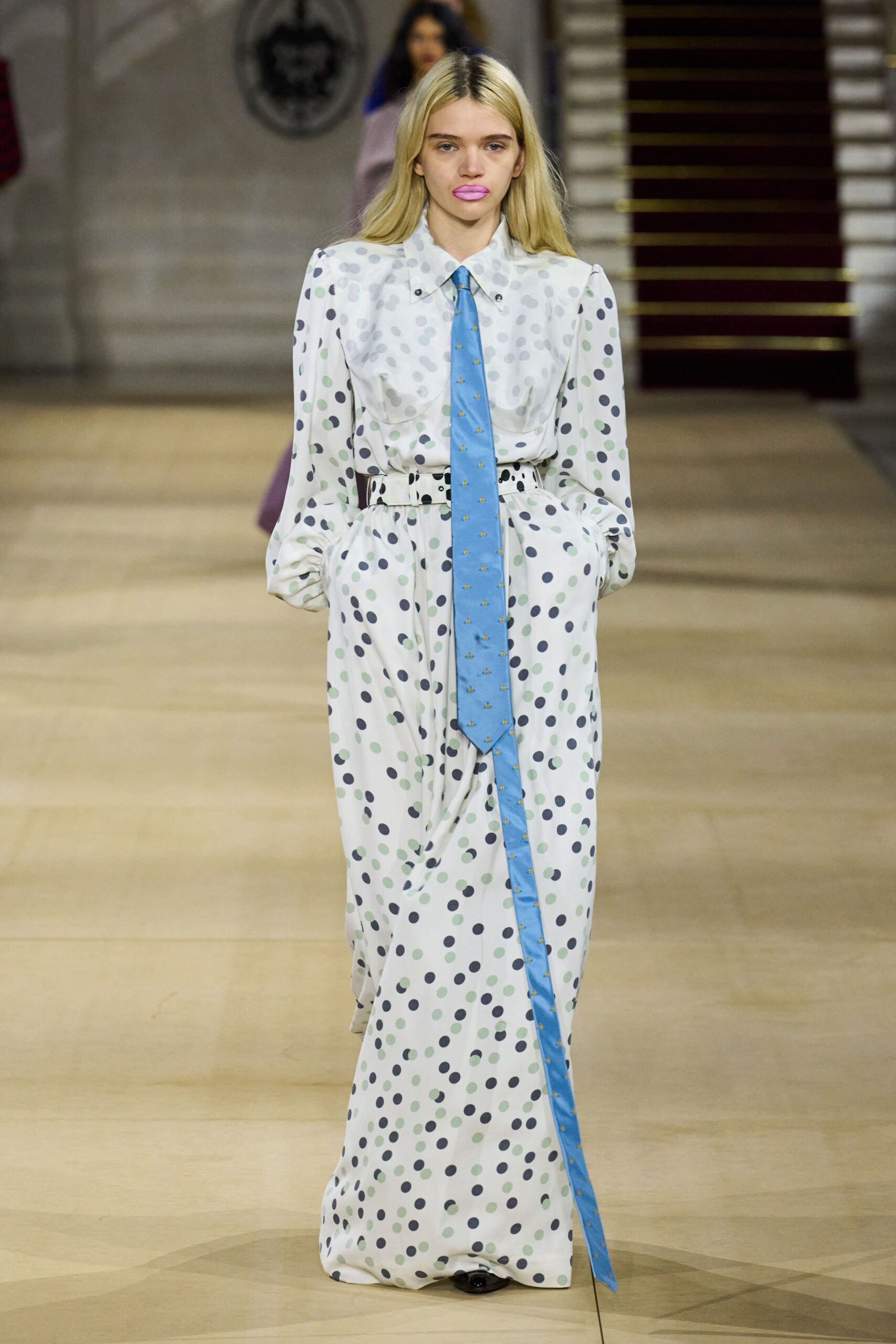 white polka-dot shirt-dress with blue tie